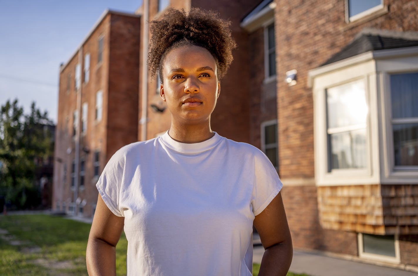 First year medical student, Emily Otiso, 25, stands for a portrait outside of her apartment on August 9, 2020 in Detroit, Mich. Otiso felt more understood by the community in Michigan than in Minnesota where racist comments and micro-agressions were common, even in the hospital where she worked. "I'm a pretty private person, but I'm hoping if just one person sees this, hopefully it will make them think." Sylvia Jarrus for The Minneapolis Star Tribune