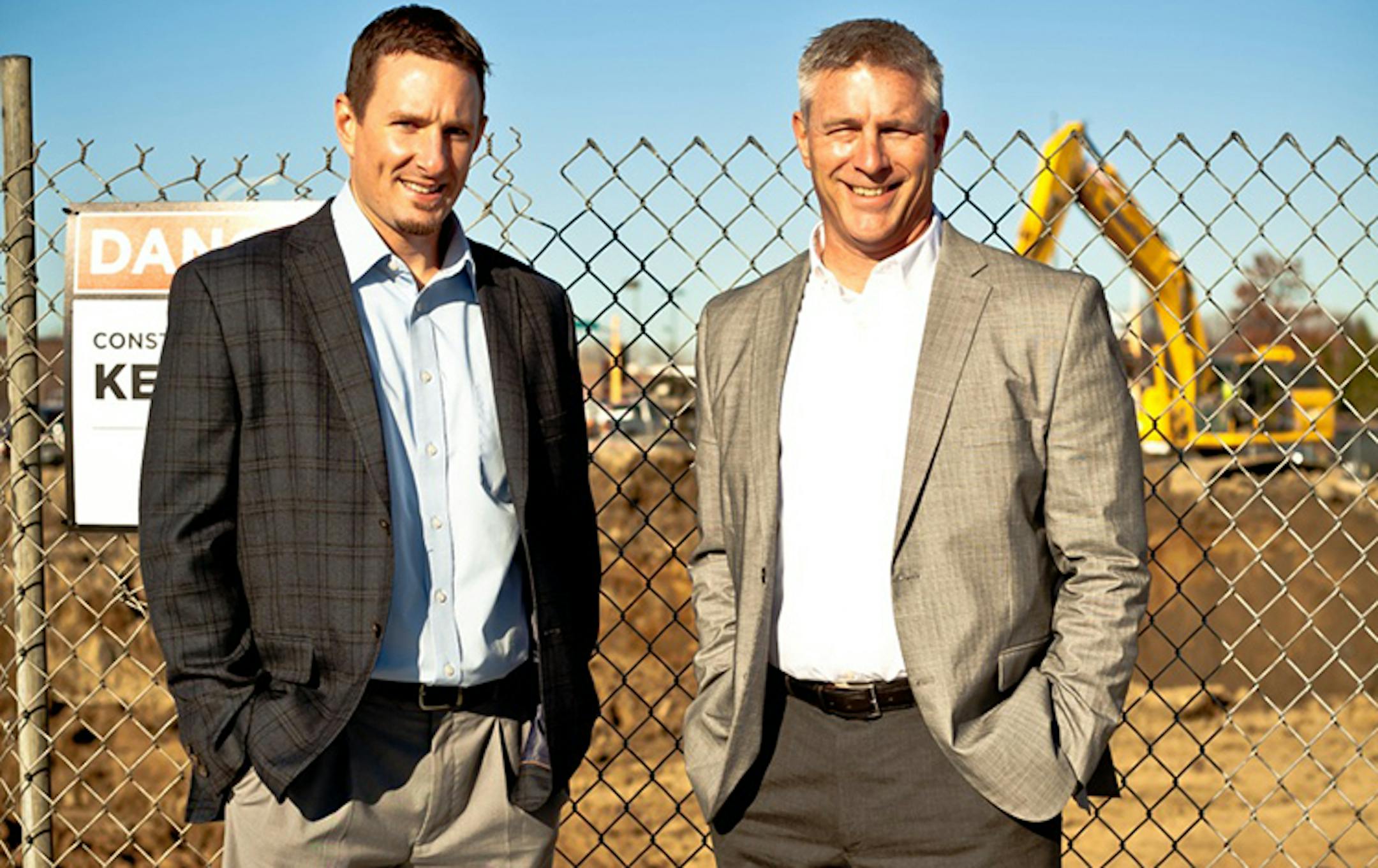 Big-D construction partners Cory Schubert (left) and Chris Grzybowski run the Twin Cities office of the Utah firm. They are pictured near a Highland Bank-retail-and-housingsite near Ridgedale shopping center in Minnetonka.