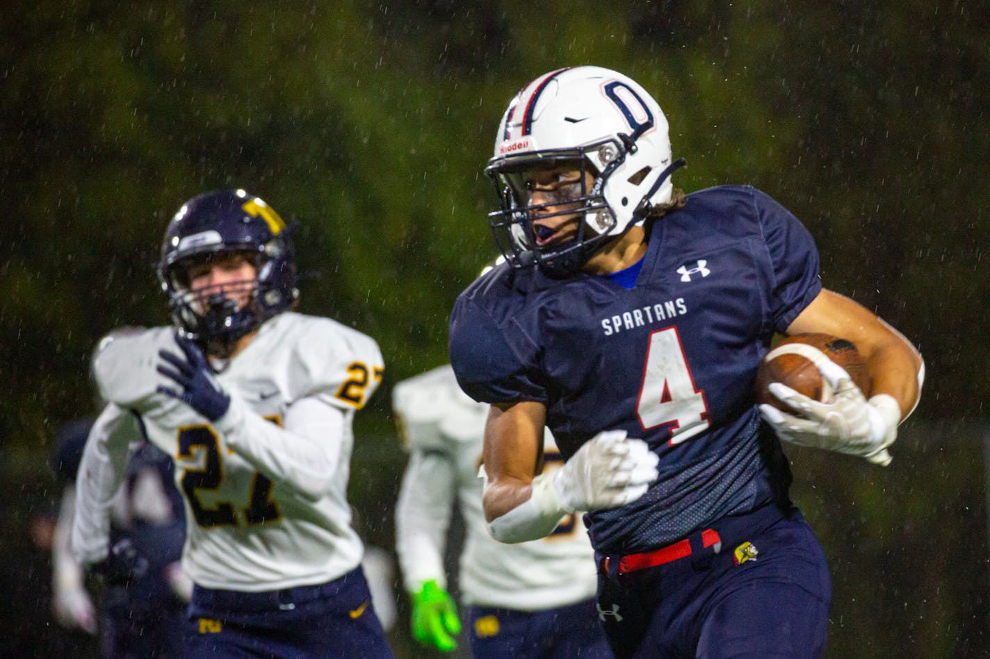 Orono running back Liam Rodgers (4) breaks away from the defense during the first half of an Orono game against Totino-Grace at Orono High School Friday, Oct. 13, 2023.