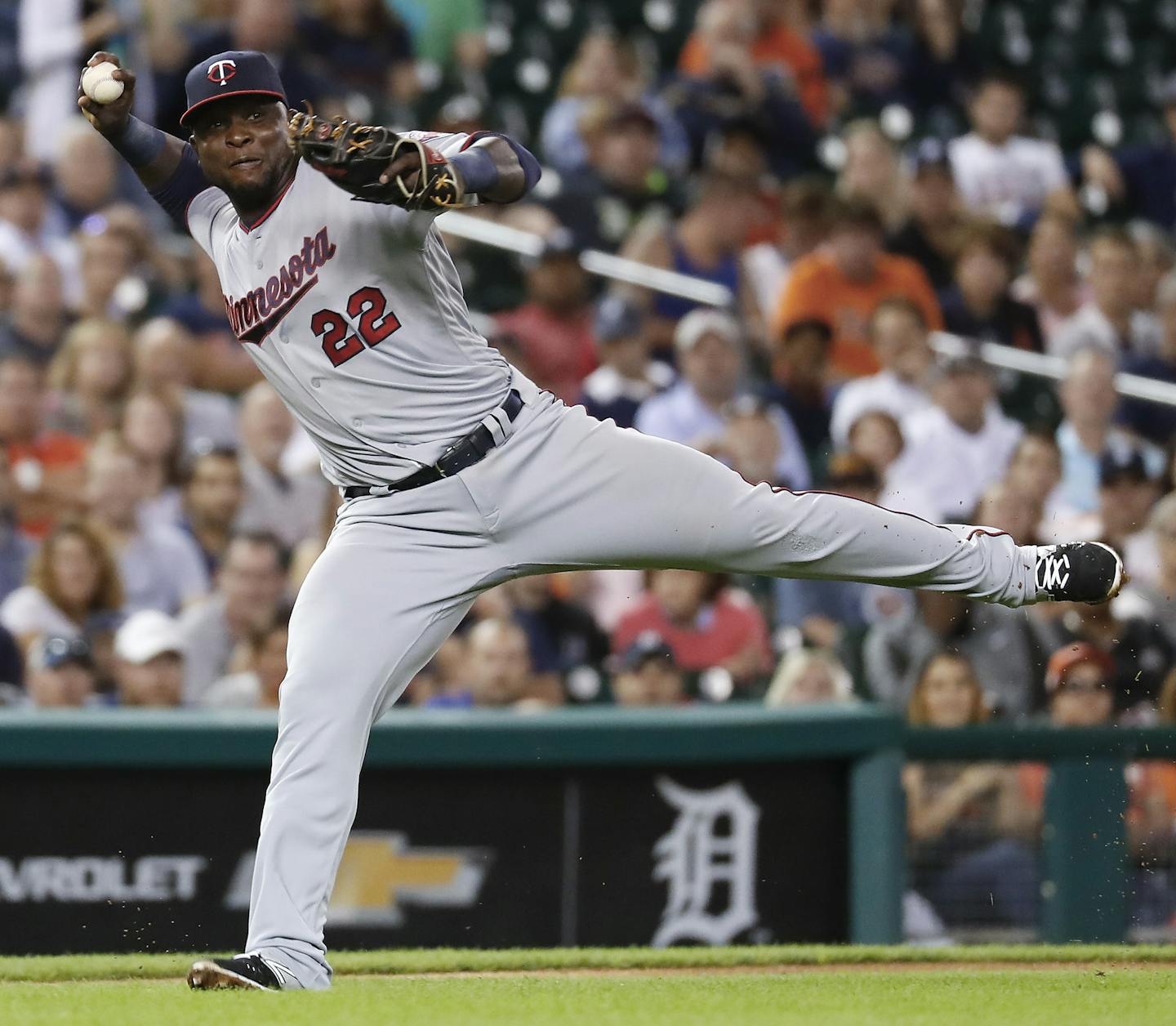 Minnesota Twins third baseman Miguel Sano (22) throws to first base for an out against Detroit Tigers' J.D. Martinez in the third inning during a baseball game in Detroit, Monday, Sept. 12, 2016. (AP Photo/Paul Sancya)