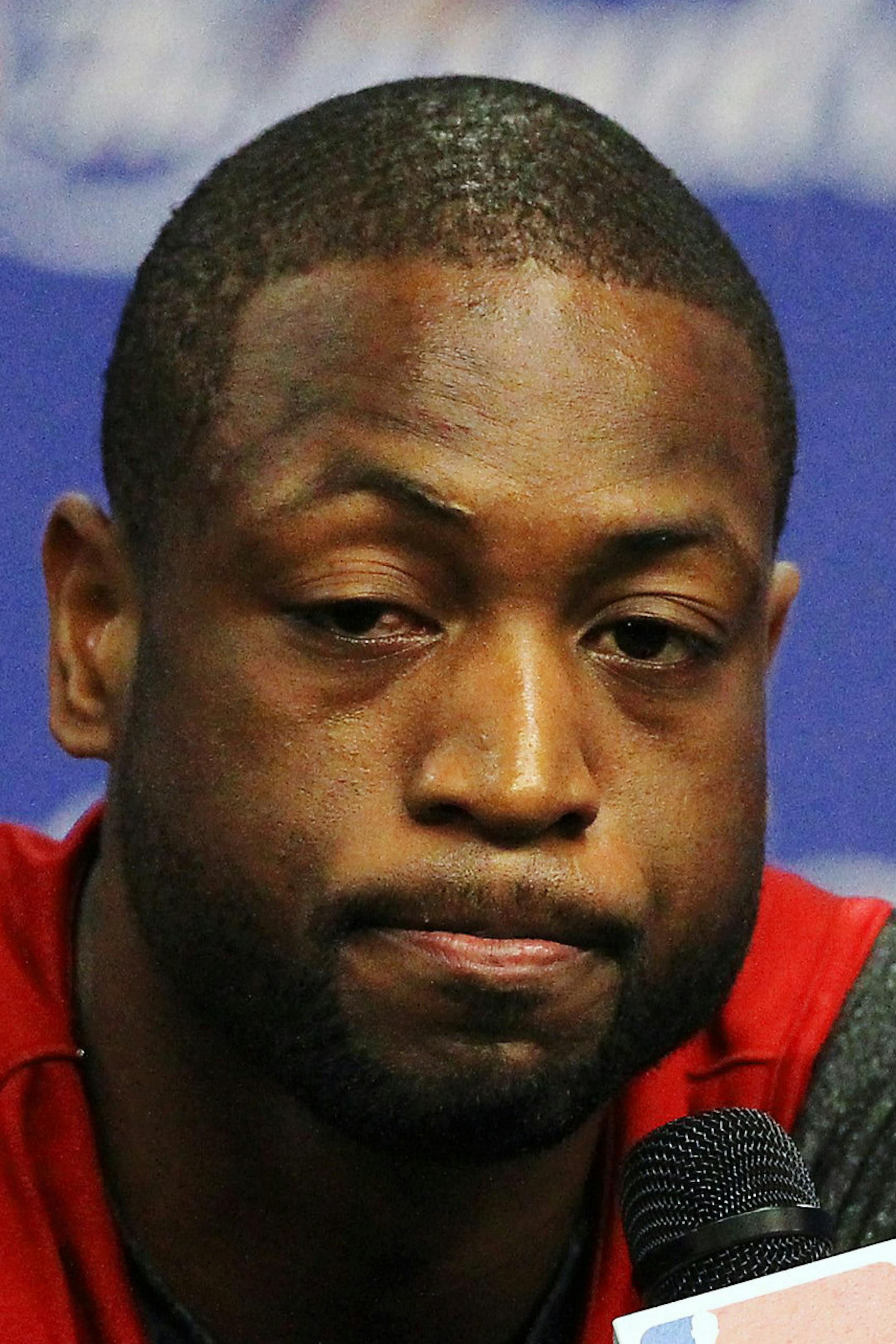 Miami Heat guard Dwyane Wade speaks with reporters before the NBA basketball team's practice on Wednesday, June 12, 2013, in San Antonio. The Heat are scheduled to face the San Antonio Spurs in Game 4 of their NBA Finals basketball series on Thursday. (AP Photo/El Nuevo Herald, David Santiago)