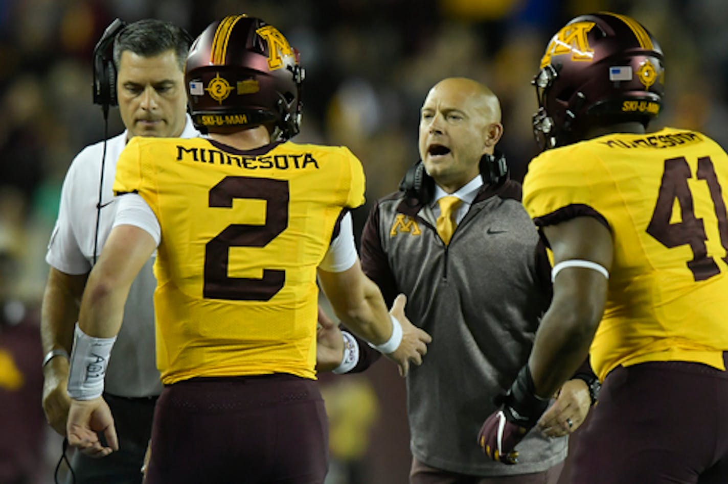 Minnesota Gophers head coach  PJ Fleck celebrated with quarterback Tanner Morgan (2) after a second quarter touchdown against the South Dakota State Jackrabbits.