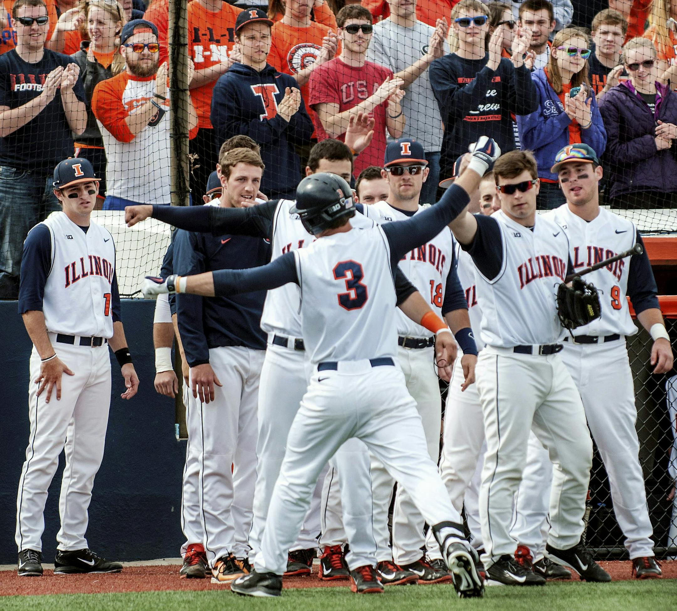FILE - In this March 15, 2015, file photo, Illinois right fielder Casey Fletcher (3) is congratulated after hitting a home against Southern Illinois in an NCAA college baseball game in Champaign, Ill. There are a lot of reasons Illinois has won 40 games this season, including 21 in a row. (Holly Hart/The News-Gazette via the AP, File)