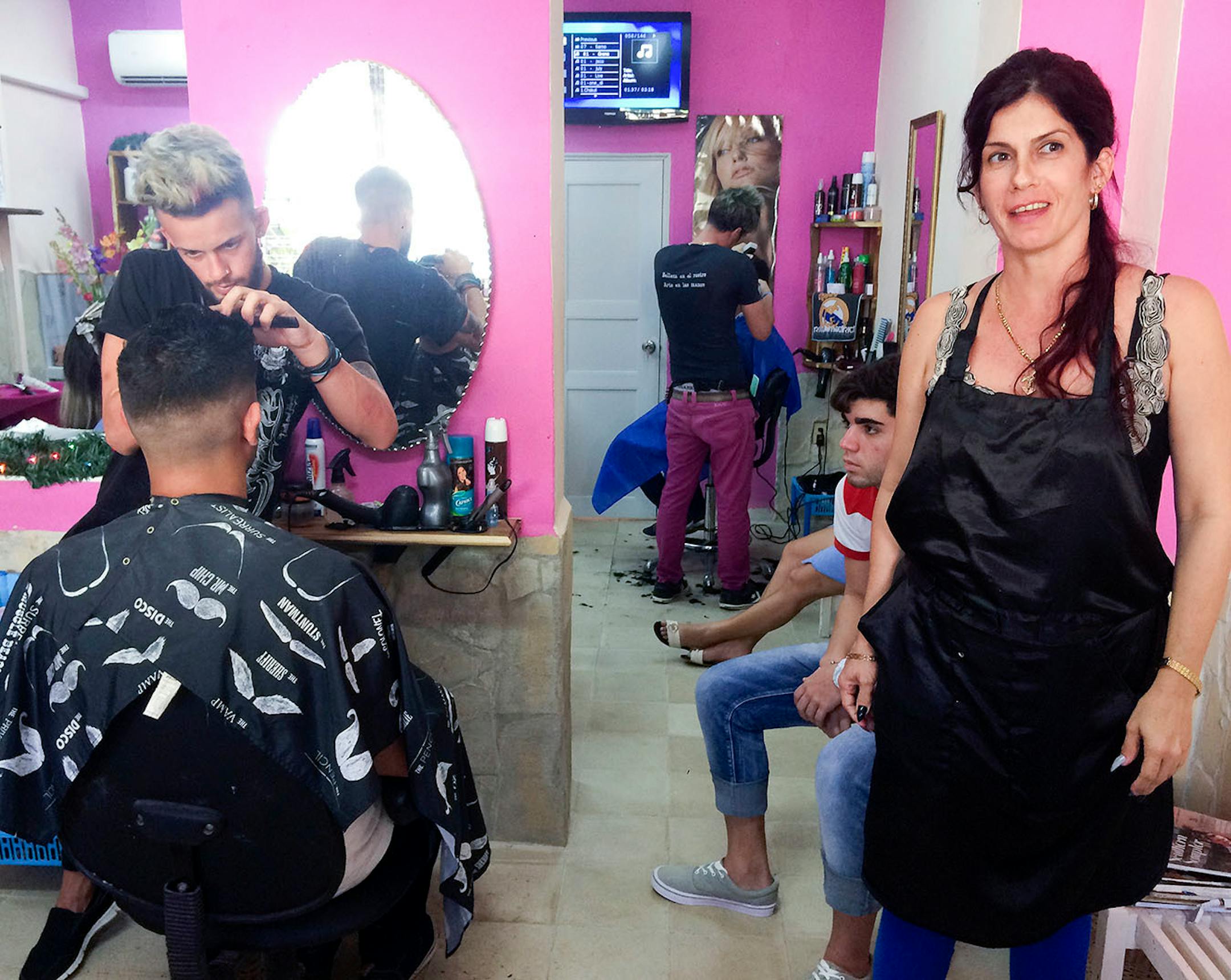 Beauticians cut hair and paint nails at one of Santa Clara's small salons. [ Photos by Amelia Rayno
The Minneapolis Star Tribune