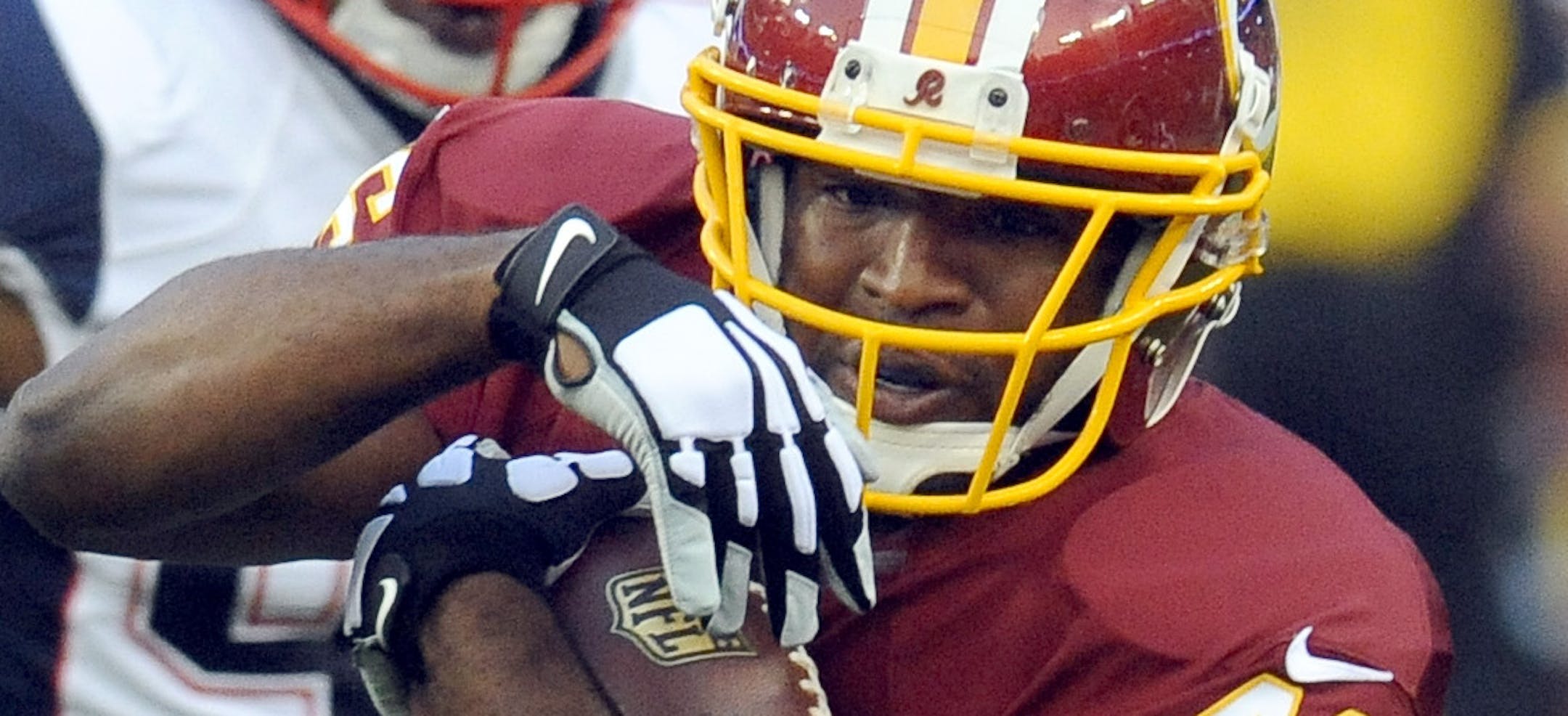 Redskins running back Alfred Morris (46) gets into the New England secondary as Patriots Steve Beauharnais (58) eyes the ball carrier during the first half of an NFL football preseason game in Landover, Md., Thursday, Aug. 7, 2014. (AP Photo/Richard Lipski)