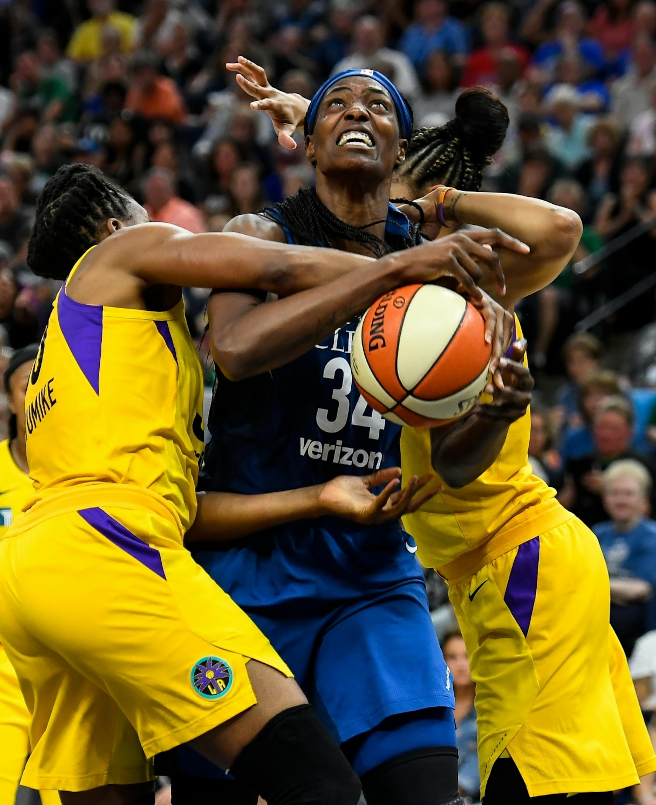 Los Angeles Sparks forward Nneka Ogwumike (30) and forward Candace Parker (3) got physical with Minnesota Lynx center Sylvia Fowles (34), but no foul was called, leading to an argument between Minnesota Lynx head coach Cheryl Reeve and and official, resulting in Reeve's ejection in the second half.