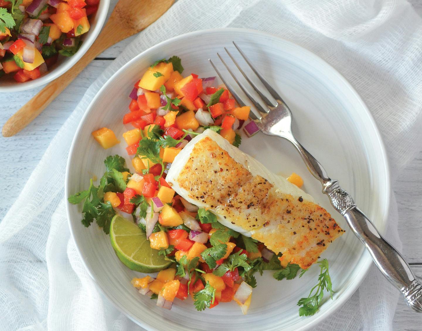 White Fish with Papaya Red Pepper Salsa, from "For the Love of Seafood" by Karista Bennett (Countryman 2023). Photo provided