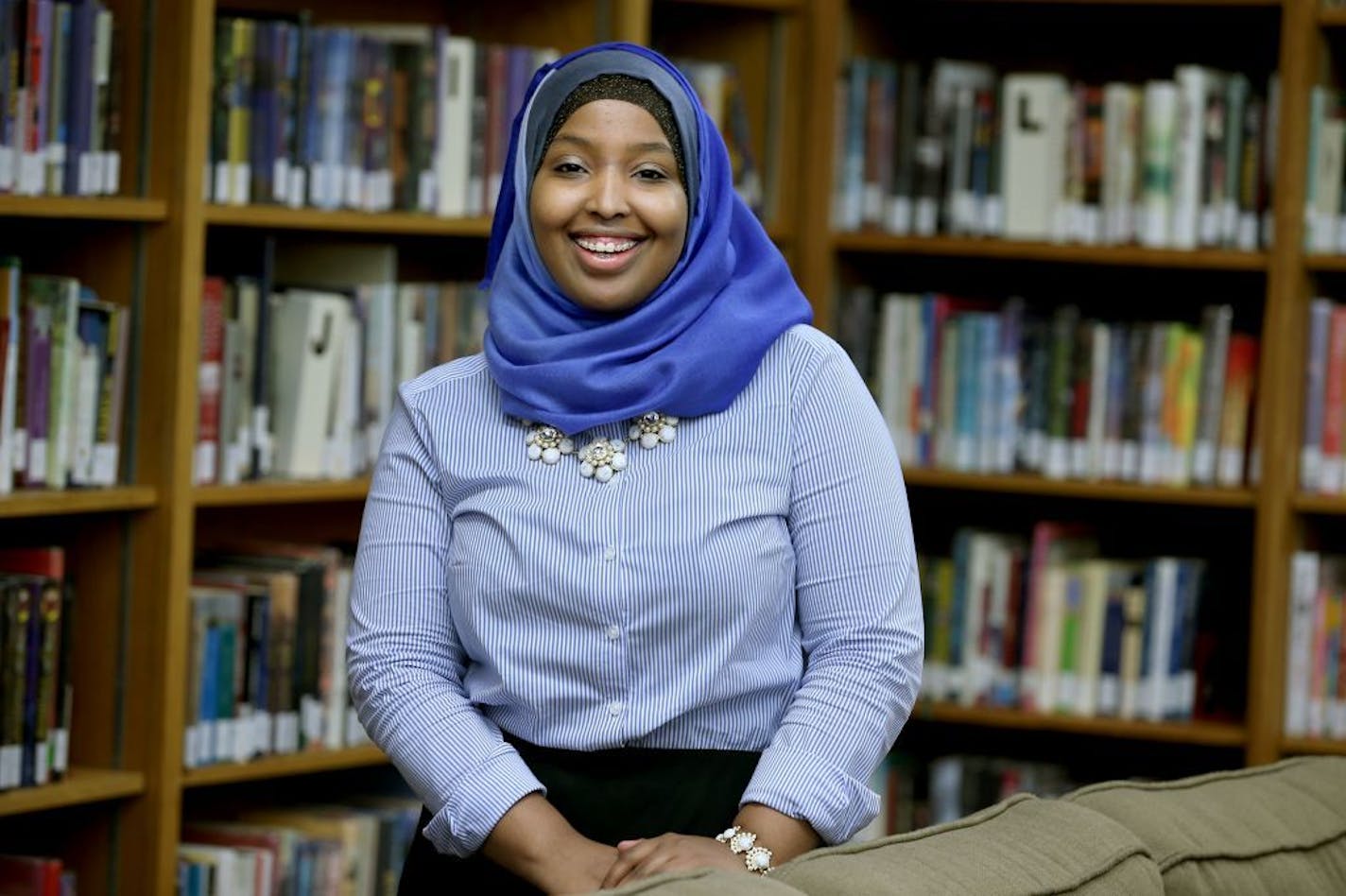 Munira Khalif stood in the Mounds Park Academy Library, Thursday, October 23, 2014 in St. Paul, MN. Khalif, a 17-year-old senior, founded a nonprofit and lobbied for legislation against child marriage and help build new libraries in Somalia. She even performed her spoken-word poetry for United Nations leaders and recent Nobel Prize-winner Malala Yousafzai.