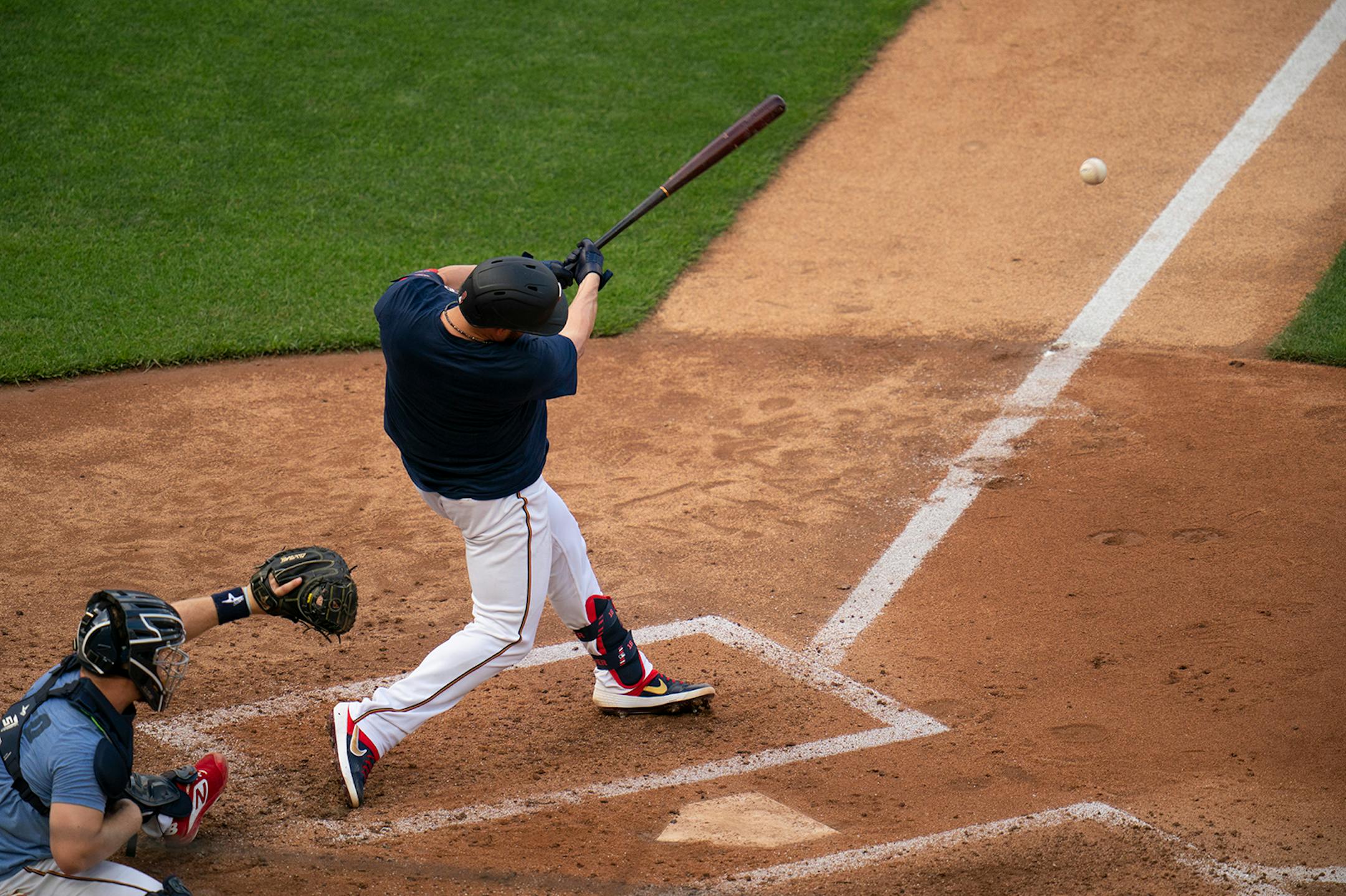 Minnesota Twins catcher Mitch Garver (8) hit during live batting practice Monday evening.