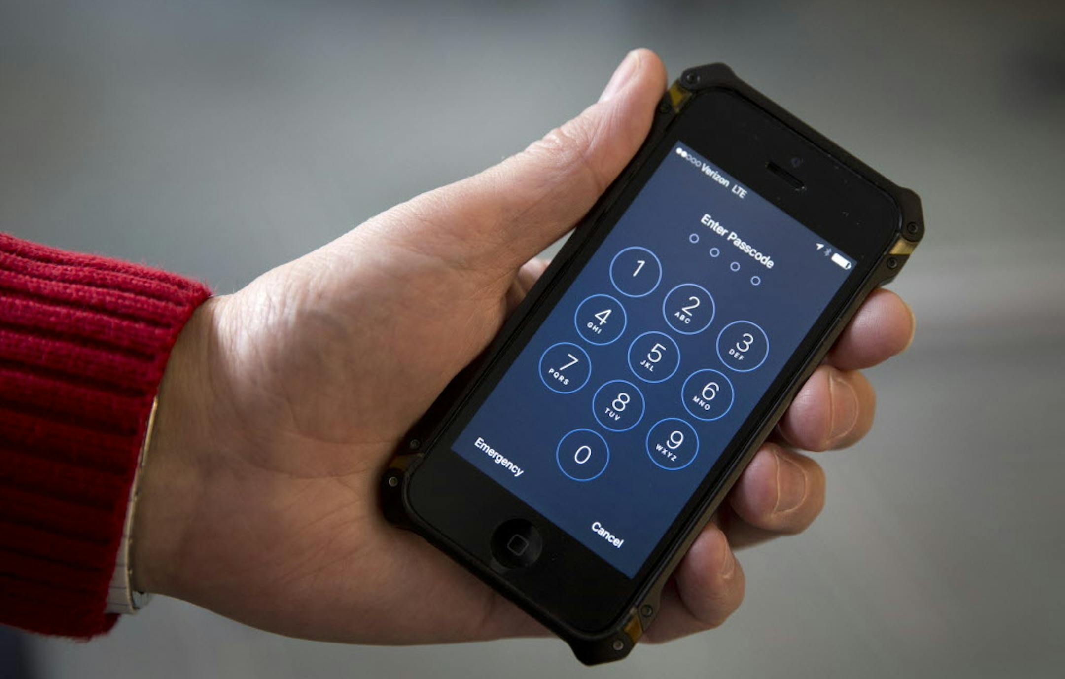 An iPhone is seen in Washington, Wednesday, Feb. 17, 2016. A U.S. magistrate judge has ordered Apple to help the FBI break into a work-issued iPhone used by one of the two gunmen in the mass shooting in San Bernardino, California, a significant legal victory for the Justice Department in an ongoing policy battle between digital privacy and national security. Apple CEO Tim Cook immediately objected, setting the stage for a high-stakes legal fight between Silicon Valley and the federal government.