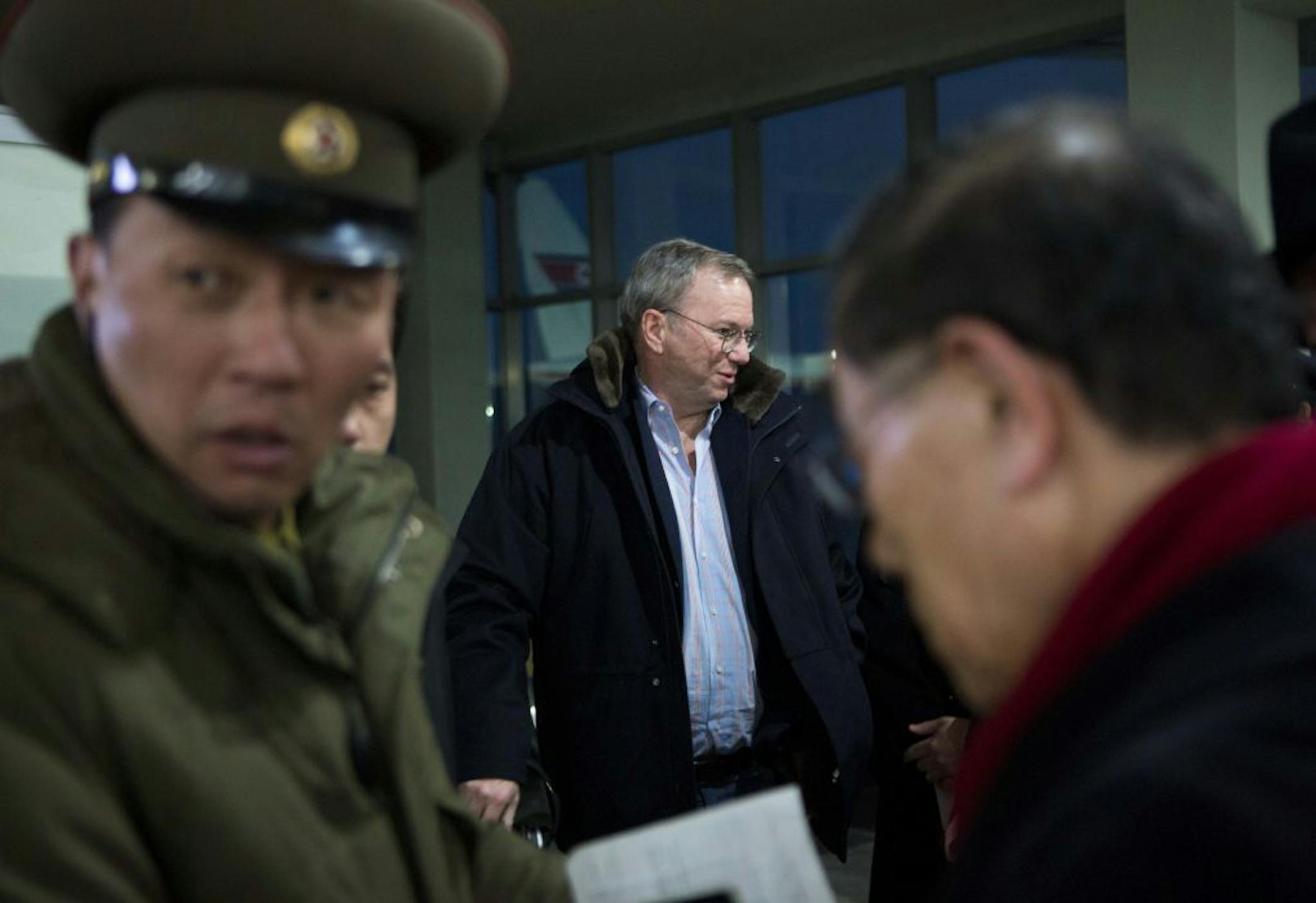 Executive Chairman of Google Eric Schmidt, center, arrives at Pyongyang International Airport in Pyongyang, North Korea on Monday, Jan. 7, 2013. Schmidt arrived in the North Korean capital along with former New Mexico Gov. Bill Richardson. Richardson called the trip to North Korea a private humanitarian visit.