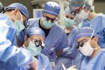 In this June 13, 2016 photo provided by the Mayo Clinic, a medical team performs a face transplant surgery at the medical center in Rochester, Minn. I