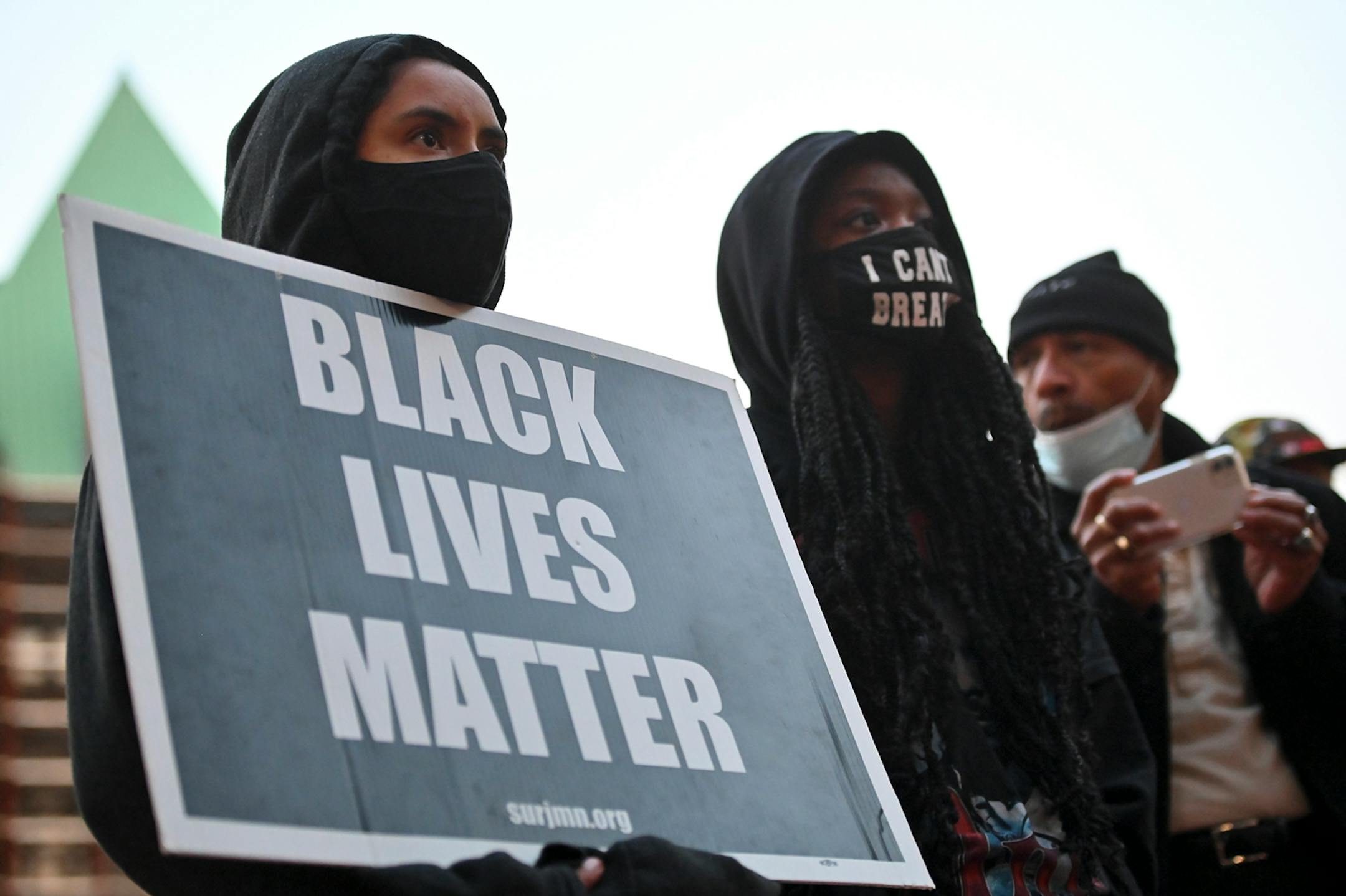 Protesters listened to speakers outside Hennepin County Government Center, a day after the release of Derek Chauvin, the former Minneapolis Police officer charged with murdering George Floyd.