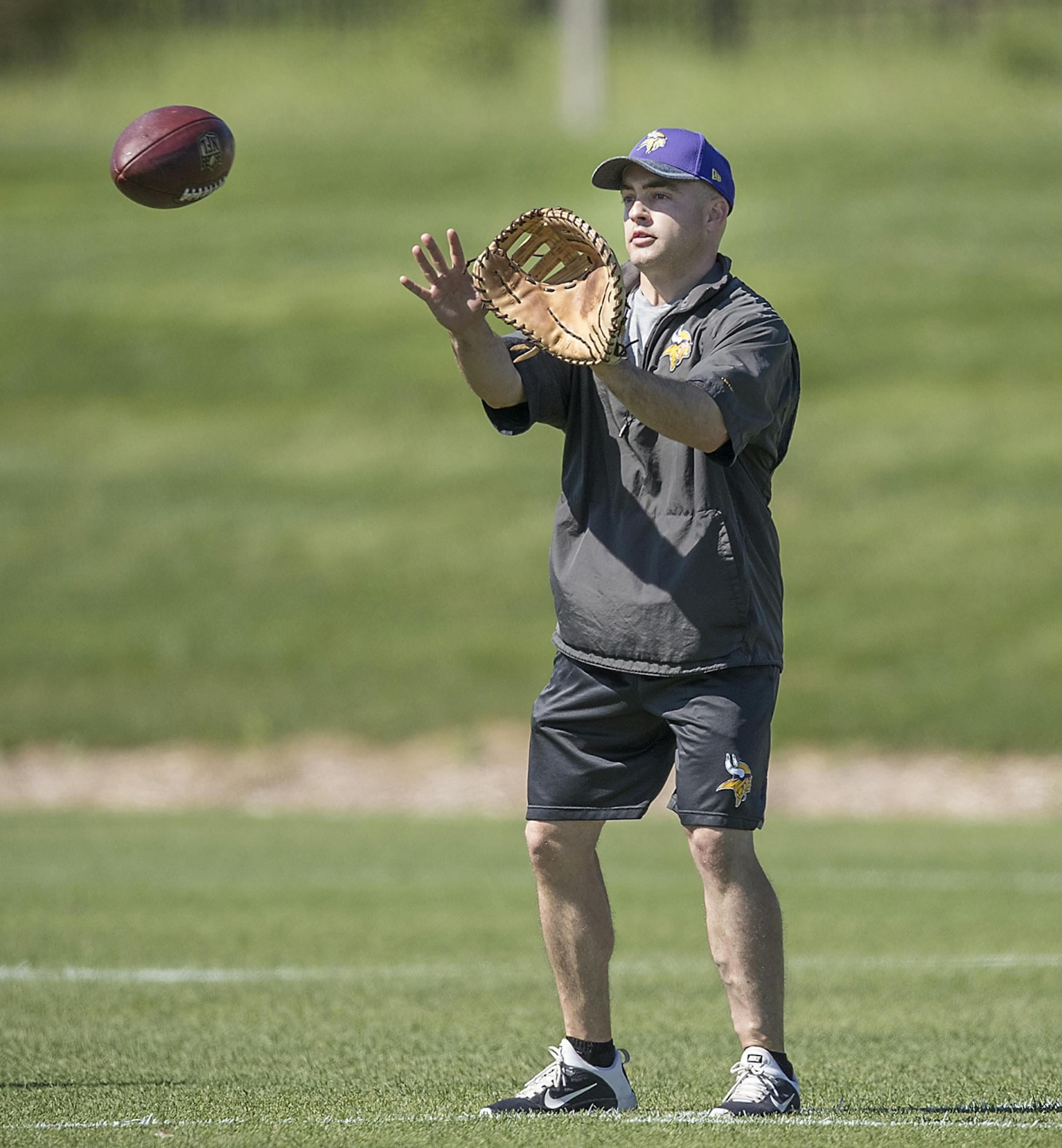 Drew Petzing, an assistant quarterbacks coach, ran drills with a baseball glove during a mandatory Vikings three-day minicamp at the TCO Performance Center, June 13, 2018 in Eagan, MN.