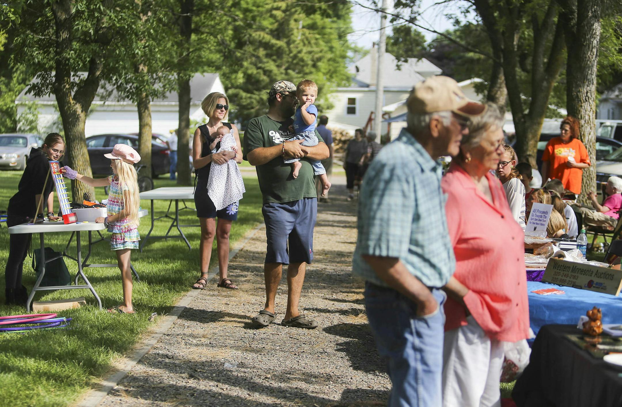 Hoffman resident gather at the weekly Hoffman flea market in the main town park Wednesday, July, 16, 2014, in Hoffman MN.] (DAVID JOLES/STARTRIBUNE) djoles@startribune When Muriel Krusemark, 73, moved back to her hometown of Hoffman, Minn., there were few open storefronts on Main Street. But since she became the part-time economic development director, each vacant space has been filled. It's a trick that many small towns across the Midwest would like to emulate. What's her secret?