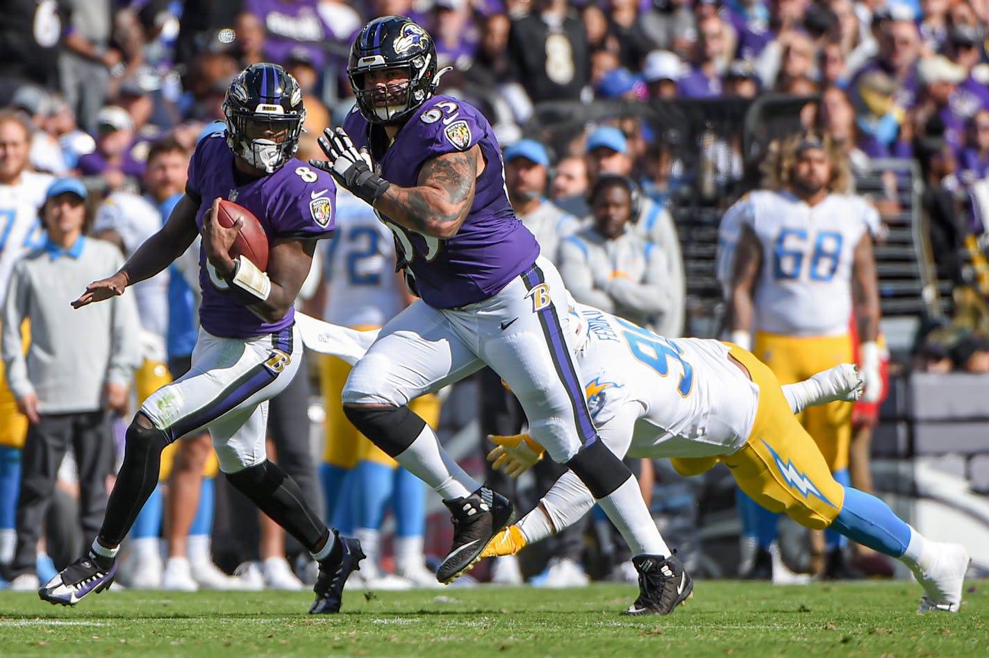 Baltimore Ravens quarterback Lamar Jackson (8) scrambles for a gain in the second quarter against the Los Angeles Chargers at M&amp;T Bank Stadium on Sunday, Oct. 17, 2021 in Baltimore. (Ulysses Muñoz/The Baltimore Sun/TNS) ORG XMIT: 30076207W