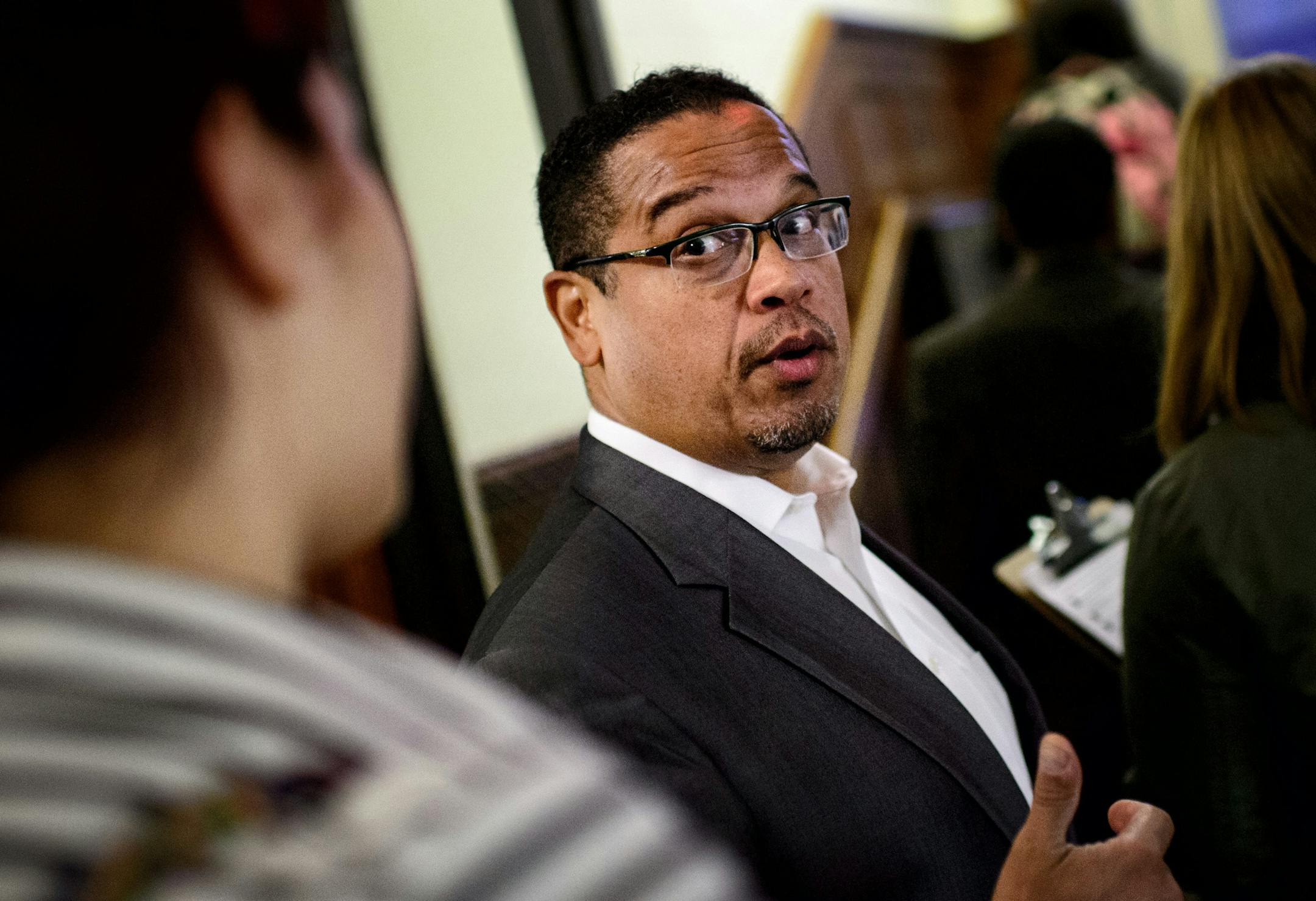 Rep Keith Ellison talked with volunteers on his way to knock on doors in the dorm. ] GLEN STUBBE * gstubbe@startribune.com Rep. Keith Ellison went door knocking with around 20 college Democrats in Pioneer Hall Dorm at the University of Minnesota, Minneapolis, to sign up new voters. Wednesday, October 8, 2014