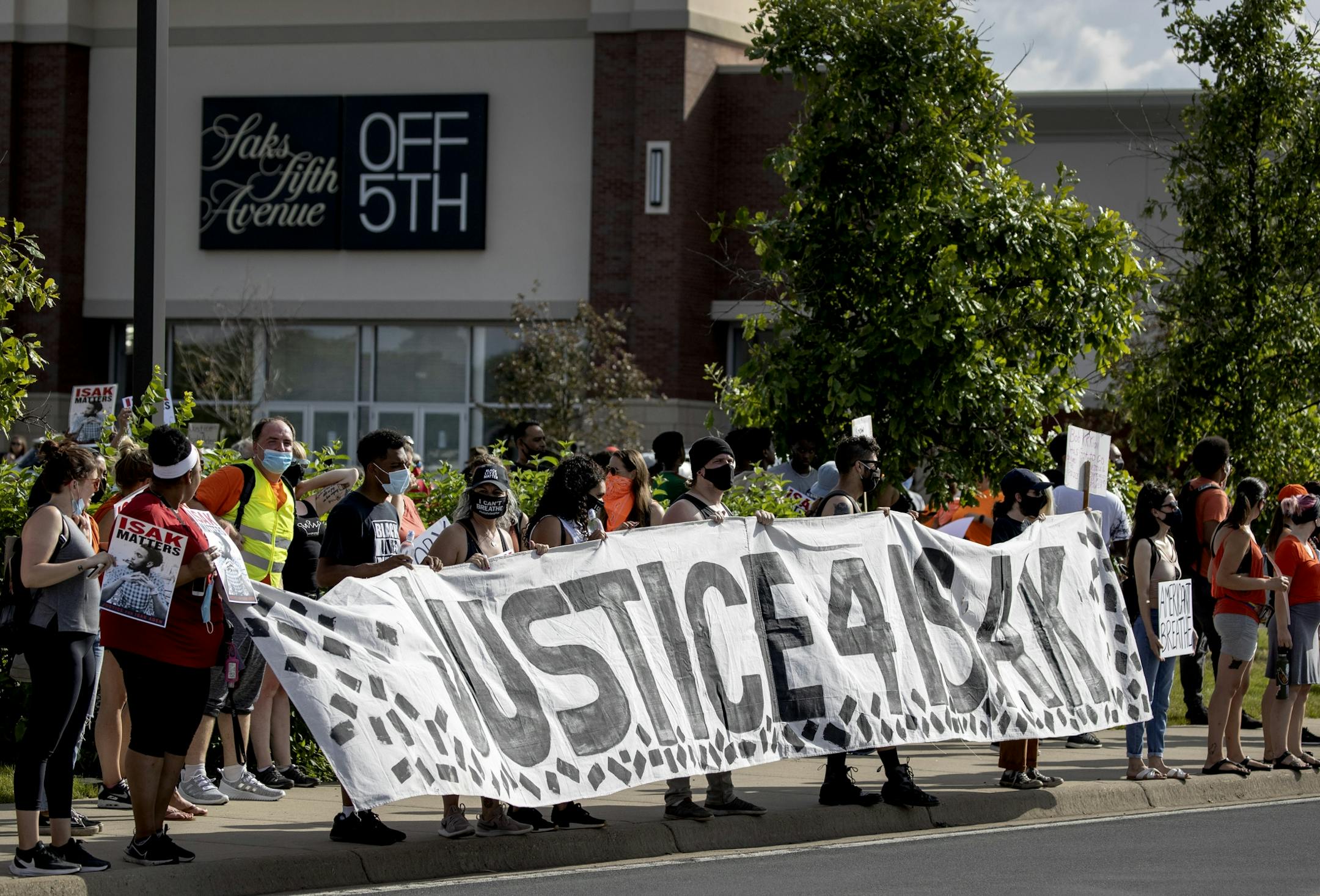 Protesters at rally & march to honor Isak Aden and Somali Independence Day that began near Twin Cities Premium Outlets in Eagan.