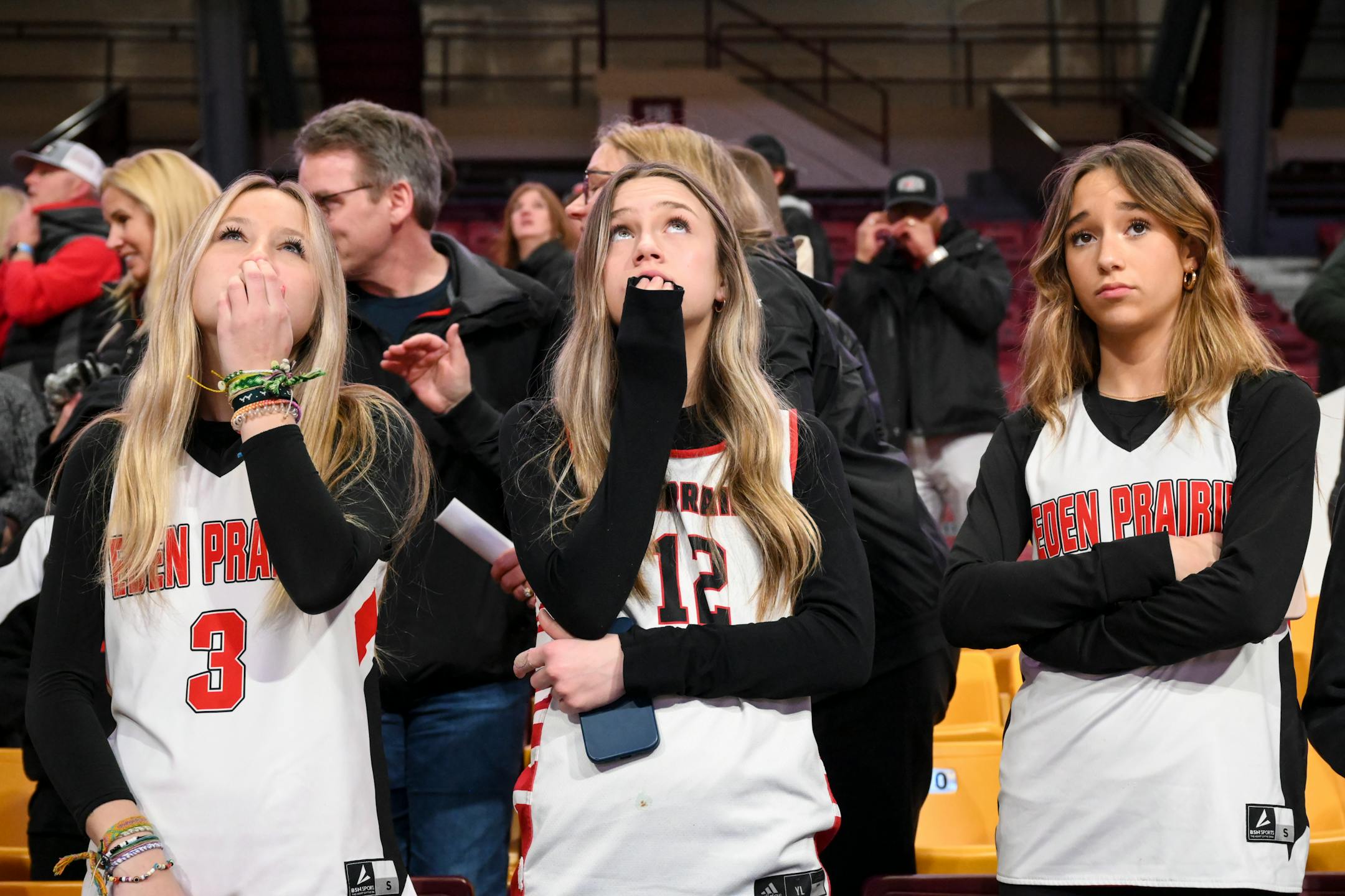 Eden Prairie fans are dejected following their team's loss against St. Michael-Albertville Thursday, March 16, 2023 during the Class 4A girls' basketball state tournament semifinals at Williams Arena in Minneapolis, Minn.. ] AARON LAVINSKY • aaron.lavinsky@startribune.com