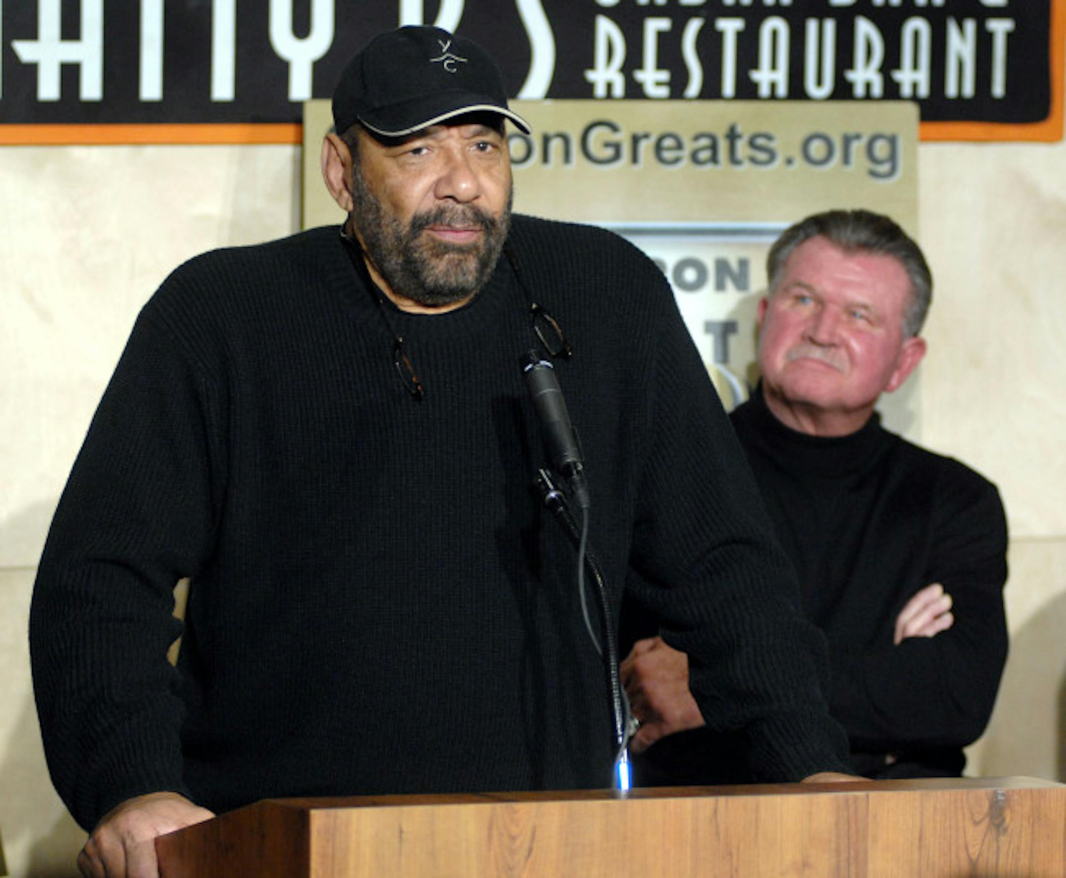 Former Minnesota Vikings player Jim Marshall speaks during a news conference promoting Gridiron Greats Assistance Fund, a charity that will provide aid to retired NFL players in need, as former Chicago Bears head coach Mike Ditka, right, looks on in Minneapolis, Tuesday, Dec. 11, 2007.