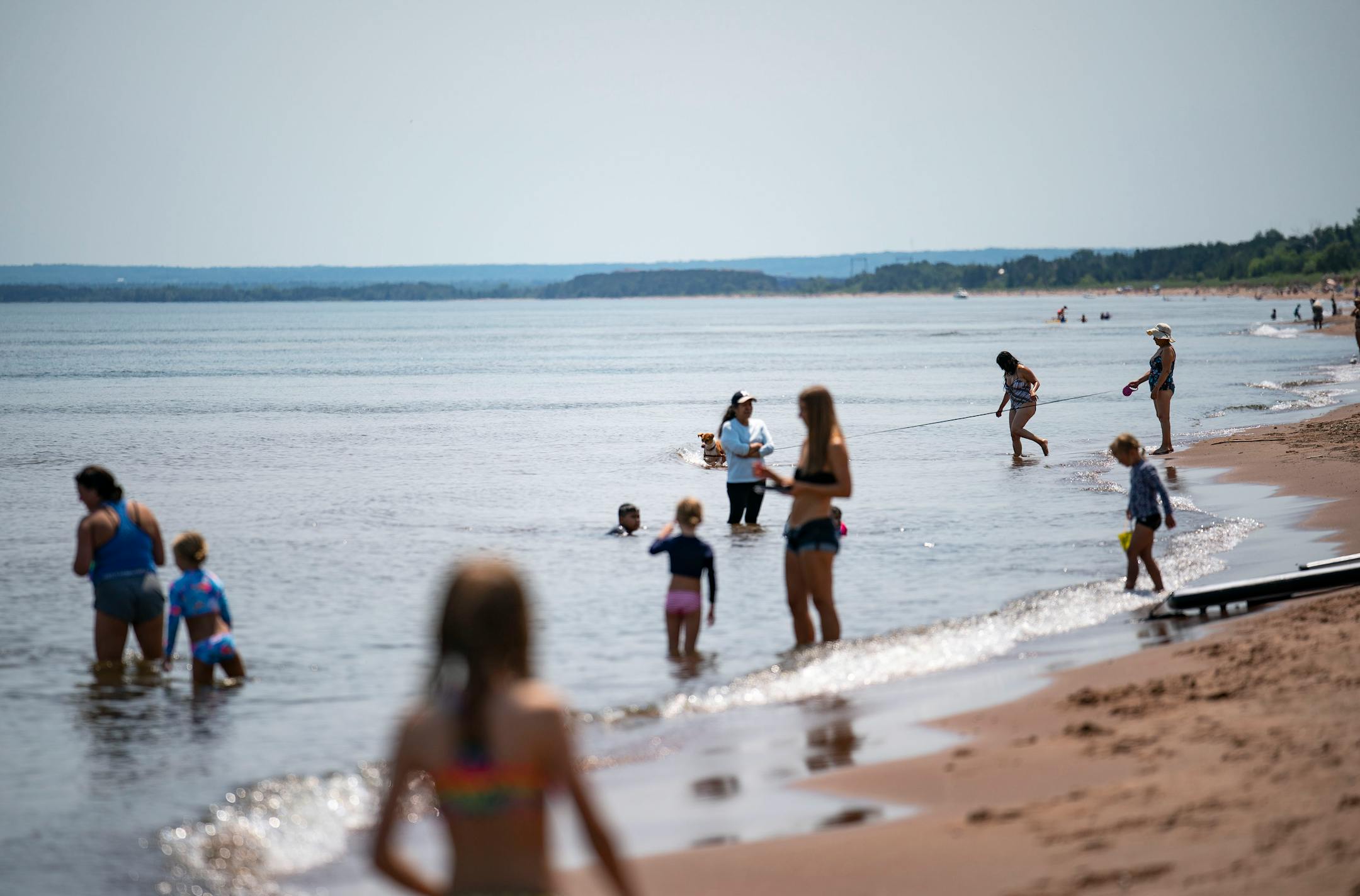 Swimmers on the shores of Lake Superior along Park Point in Duluth