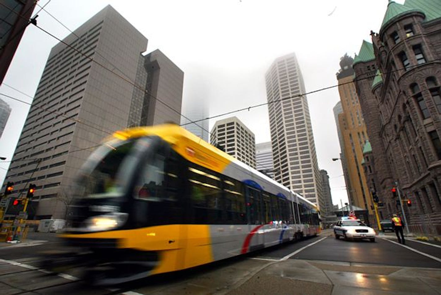 A light rail train travels near Government Center in Minneapolis.