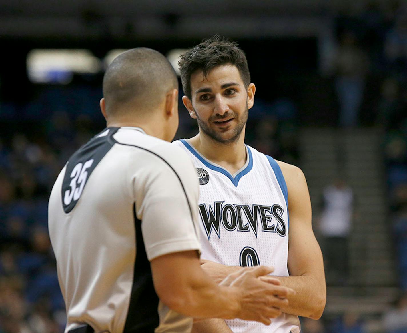 Minnesota Timberwolves guard Ricky Rubio, right, of Spain, pleads with referee Steve Anderson (35) during the first half of an NBA basketball game against the Phoenix Suns in Minneapolis, Monday, March 28, 2016.