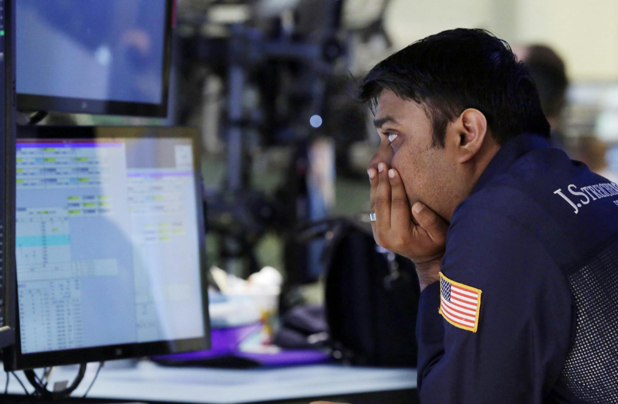 Specialist Niral Doshi works at his post on the floor of the New York Stock Exchange Monday, June 17, 2013.