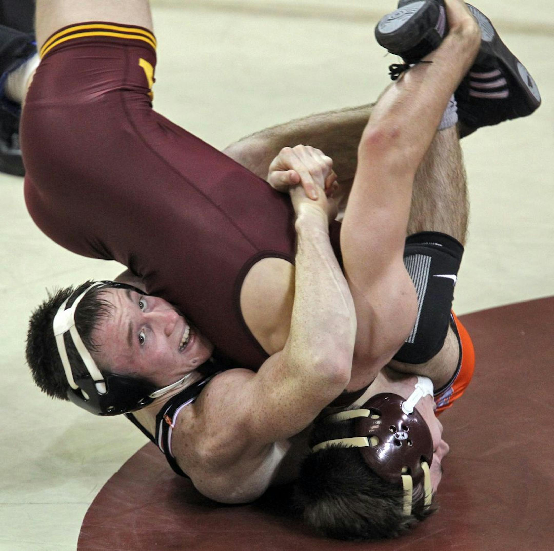 Jon Morrison, left, lost to Minnesota's Chris Dardanes 3-1 in the 133-pound match, but Oklahoma State then went on to claim the next five matches en route to the victory Sunday afternoon.