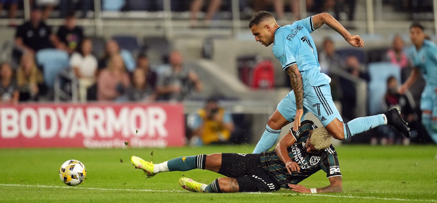 Minnesota United midfielder Franco Fragapane (7) went over the top of Los Angeles Galaxy defender Julian Araujo (2) as he raced for the ball in the first half. ] ANTHONY SOUFFLE • anthony.souffle@startribune.com