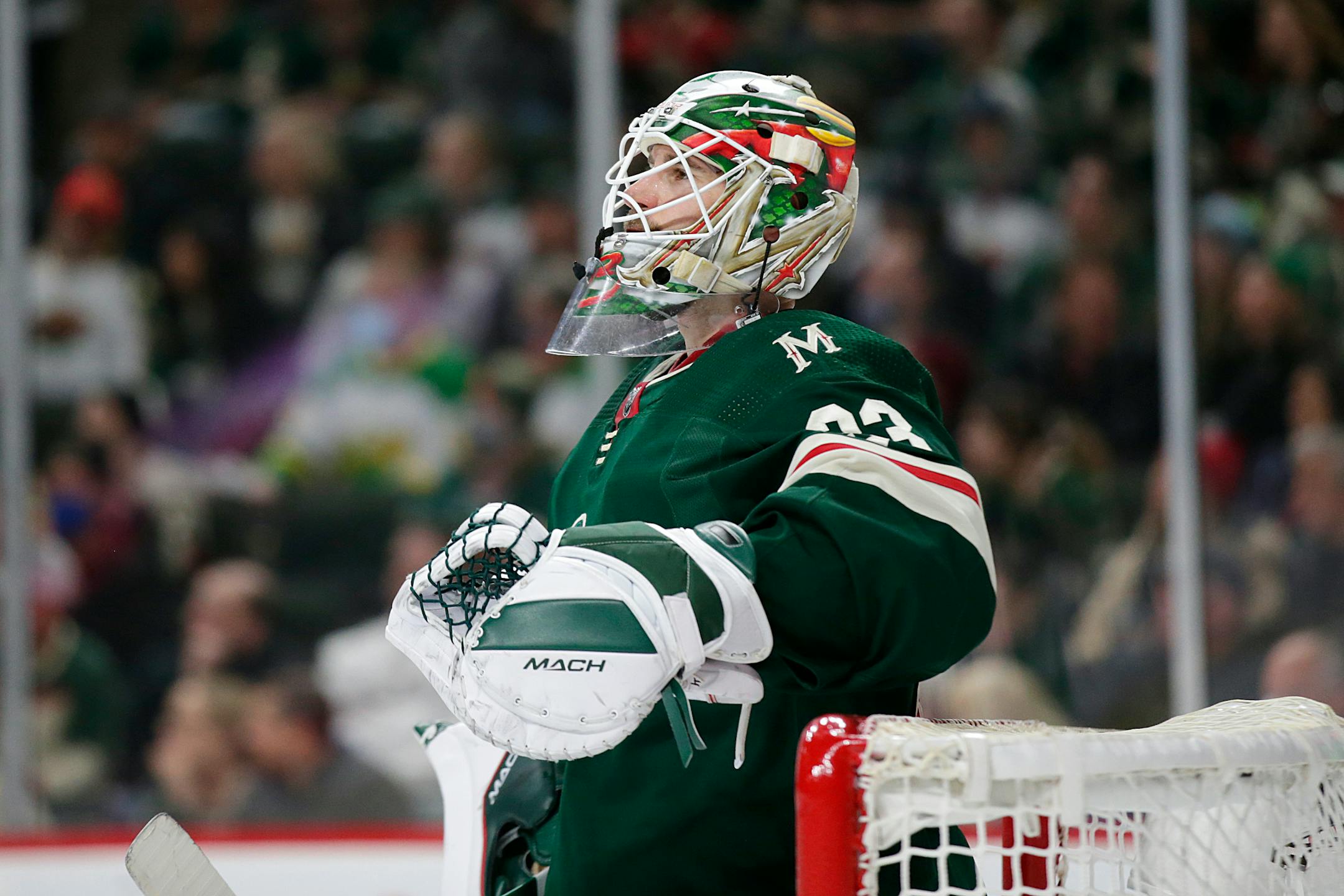 Minnesota Wild goaltender Cam Talbot looks at the scoreboard during an NHL hockey game against the Florida Panthers Friday, Feb. 18, 2022, in St. Paul, Minn. (AP Photo/Andy Clayton-King)
