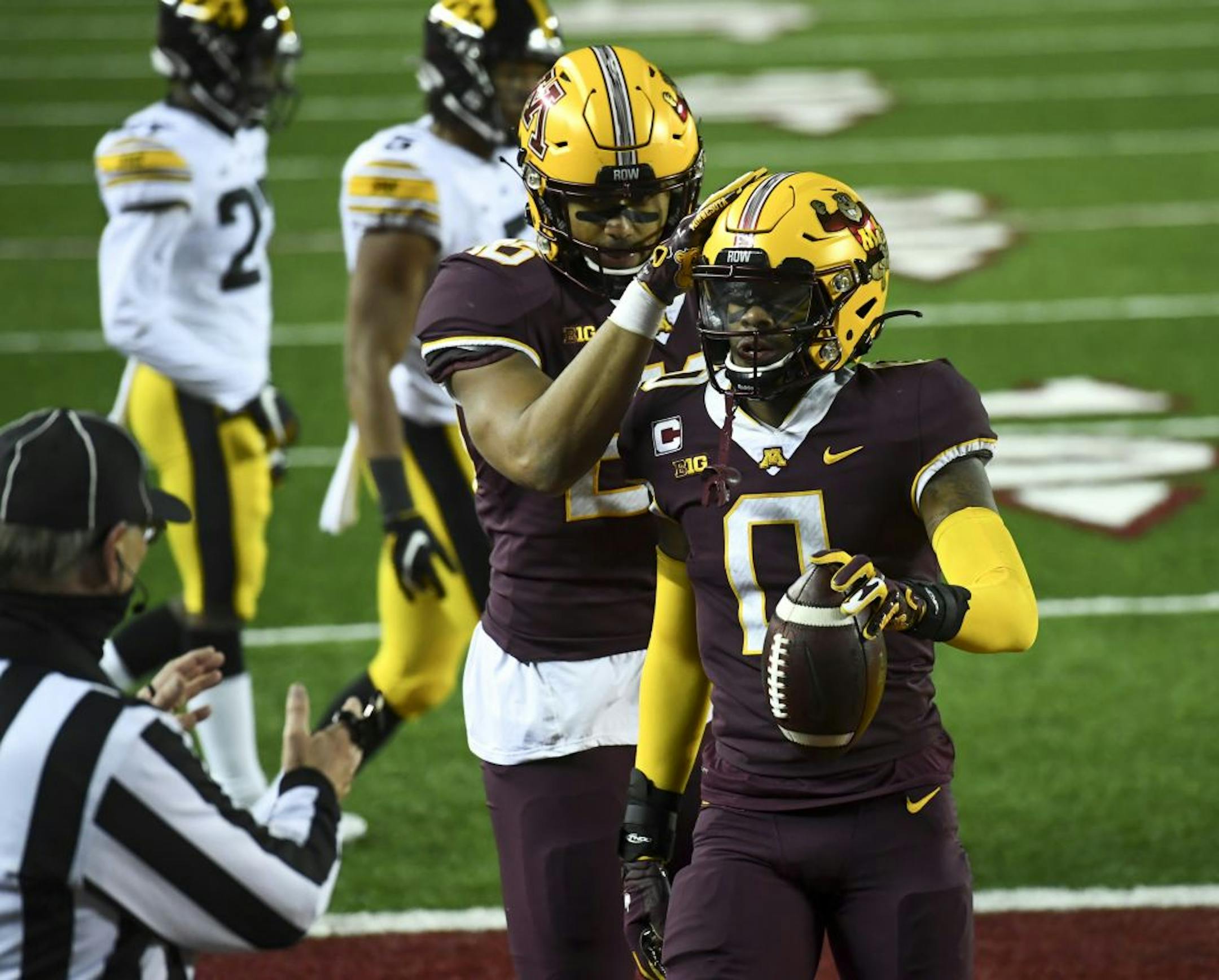 Minnesota Gophers wide receiver Rashod Bateman (0) and tight end Brevyn Spann-Ford (88) celebrated Bateman's touchdown in the waning seconds of the fourth quarter, the team's first points of the game against the Iowa Hawkeyes.