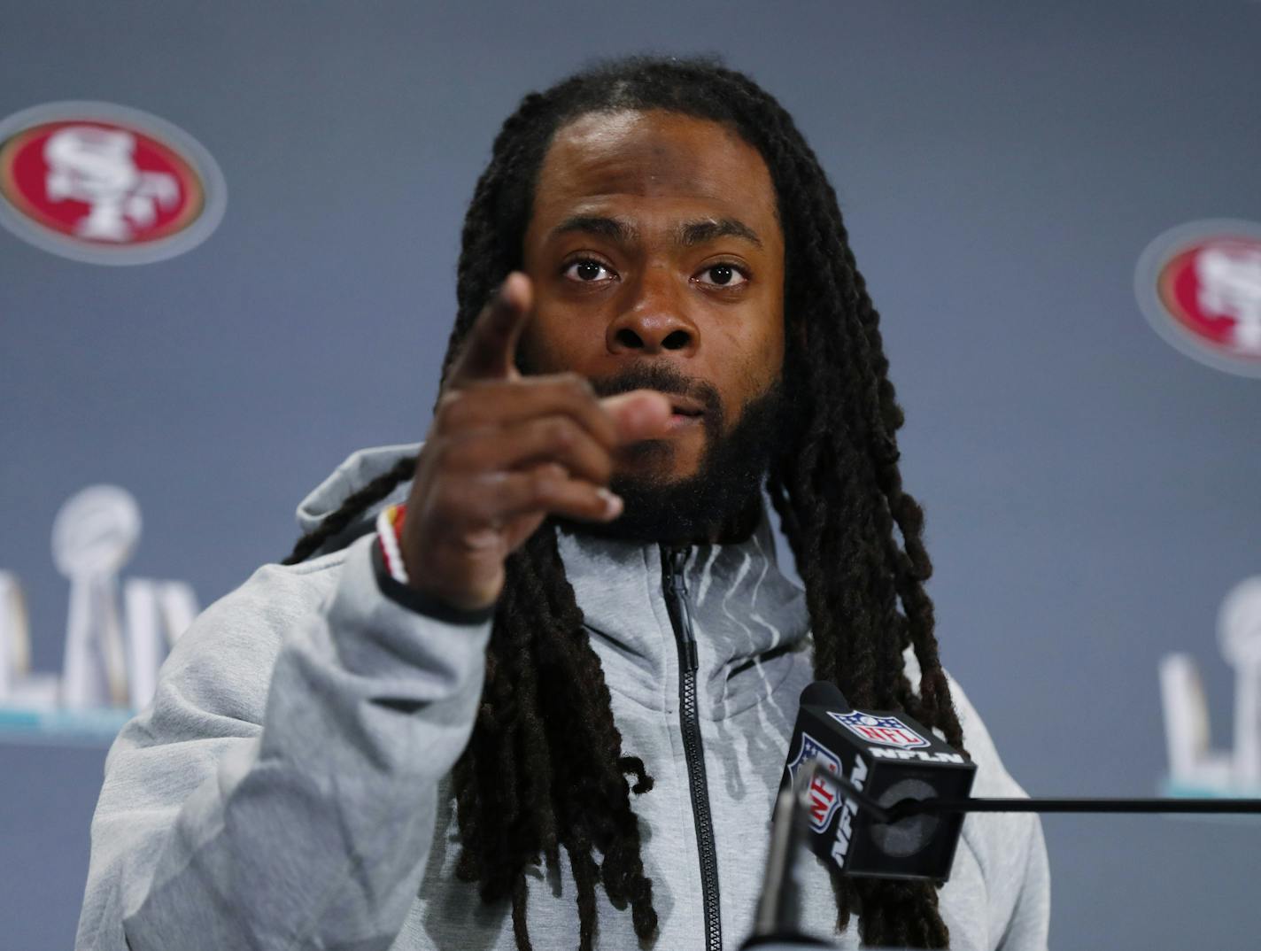 San Francisco 49ers cornerback Richard Sherman gestures as he speaks during a media availability, Wednesday, Jan. 29, 2020, in Miami, for the NFL Super Bowl 54 football game against the Kansas City Chiefs. (AP Photo/Wilfredo Lee)