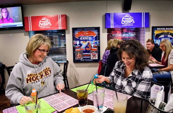 Lisa Paal and Debbie Dodge, friends and sisters-in-law, played bingo at Sticks and Stones Sports Bar in Blaine.