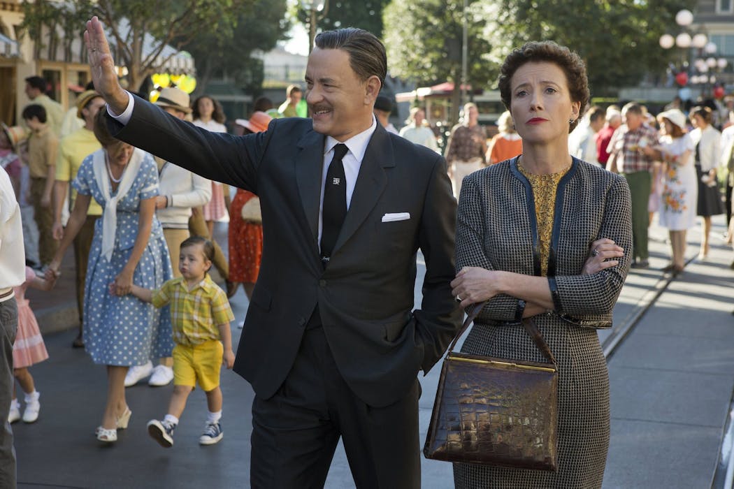 Walt Disney (Tom Hanks) shows Disneyland to 'Mary Poppins' author P.L. Travers (Emma Thompson) in 'Saving Mr. Banks.'
