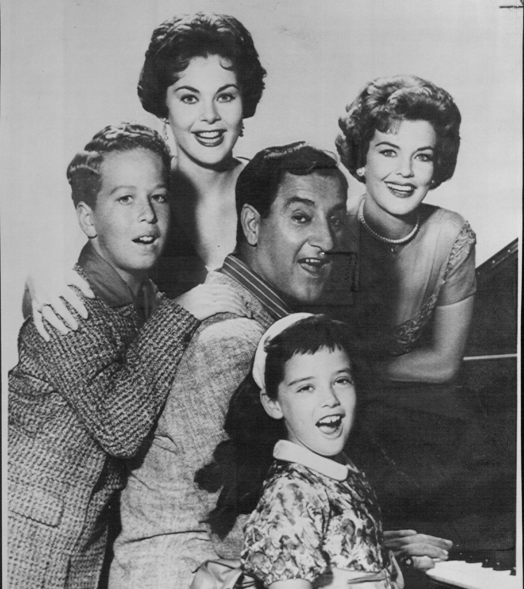 February 6, 1991 Danny Thomas Dies -- Actor And Comedian Danny Thomas, center, shown with the cast of television's "Make Room for Daddy" series, died early Wednesday of A heart attack at this Beverly Hills home. With him from left are: Rusty Hammer, Penney Parker, Thomas, Angela Cartwright and Marjorie Lord, right. February 7, 1991 AP Laserphoto