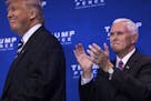 FILE � Mike Pence applauds after introducing Donald Trump at a campaign event in King of Prussia, Pa., Nov. 1, 2016. Pence used to be a harsh conser