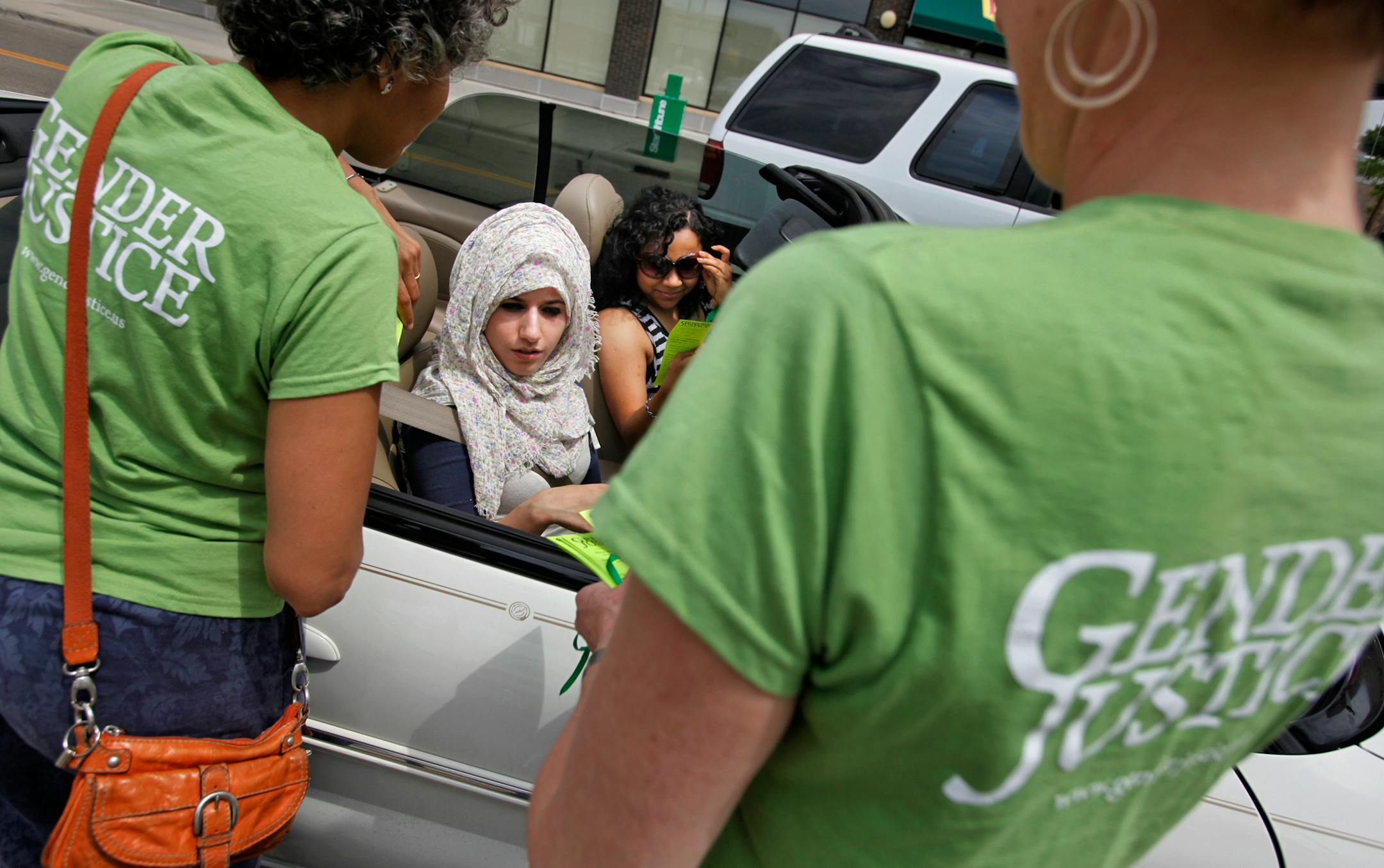 In this file photo, members of Gender Justice held an event on Lake Street in Minneapolis to call attention to the fact that women don't have the right to drive in Saudi Arabia. The group also represented the women at the center of the lawsuit against Prince Abdul-Rahman bin Abdul-Aziz.