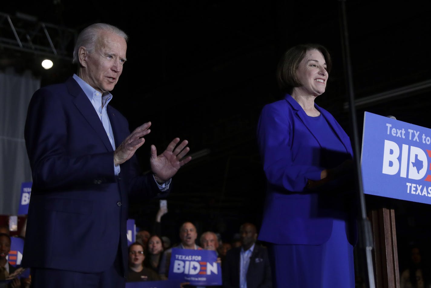 Democratic presidential candidate former Vice President Joe Biden, left, is joined by former rival Sen. Amy Klobuchar, right, during a campaign stop in Dallas, Monday, March 2, 2020. (AP Photo/Eric Gay)