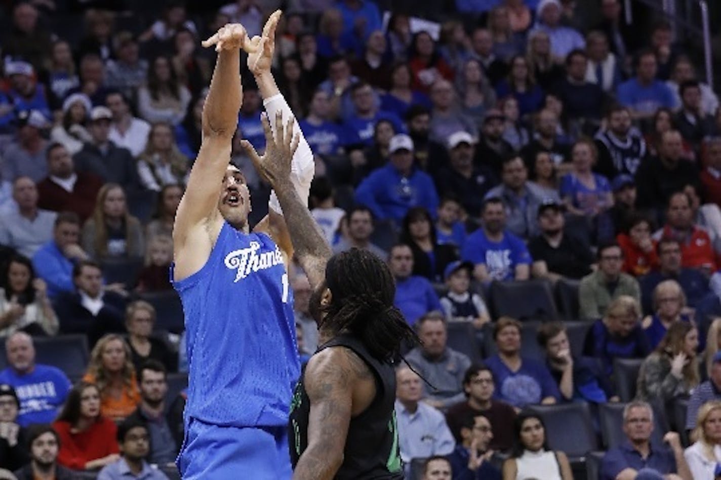 Thunder center Enes Kanter shot over Timberwolves forward Jordan Hill during the second half Sunday.