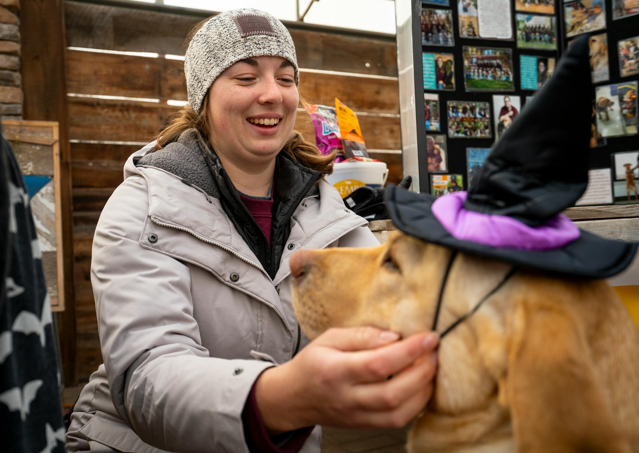 Lauren Schmitt with Pawsitive Perspectives Assistance Dogs (PawPADs) puts a witch costume on service dog Lenny at PawPAD's booth at Cottage Grove's Fall Fun Days in Cottage Grove, Minn.
