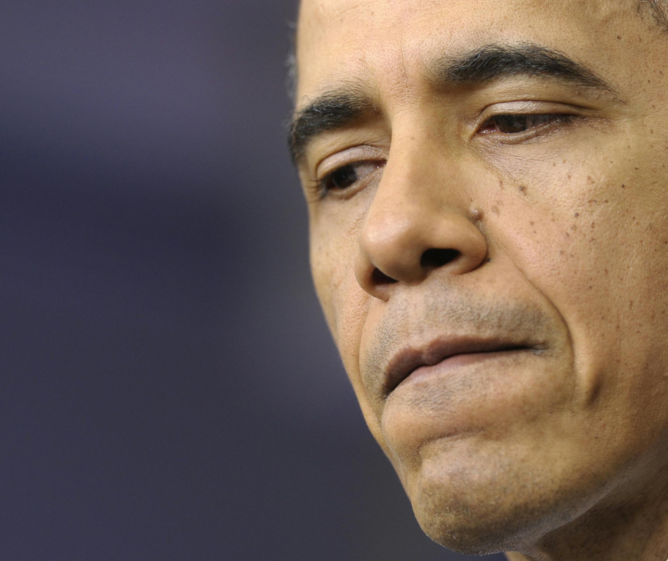 President Barack Obama answers a question during an end-of-the year news conference in the Brady Press Briefing Room at the White House in Washington, Friday, Dec. 20, 2013. At the end of his fifth year in office, Obama's job approval and personal favorability ratings have fallen to around the lowest point of his presidency. Obama will depart later for his home state of Hawaii for his annual Christmas vacation trip. It's the first time in his presidency that his departure plans have not been del