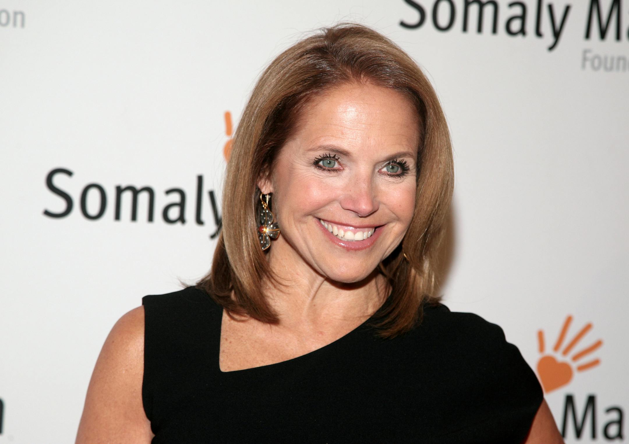 FILE - This Oct. 23, 2013 file photo shows TV host Katie Couric at the Somaly Mam Foundation Gala in New York. Couric is joining Yahoo to anchor a news program for the Internet company as it tries to expand its audience and sell more advertising. An announcement on Monday, Nov. 25, confirms recent published reports that Couric would diversify into online video programming after spending decades in broadcast television as a talk-show host and news anchor. The 56-year-old Couric will continue to h