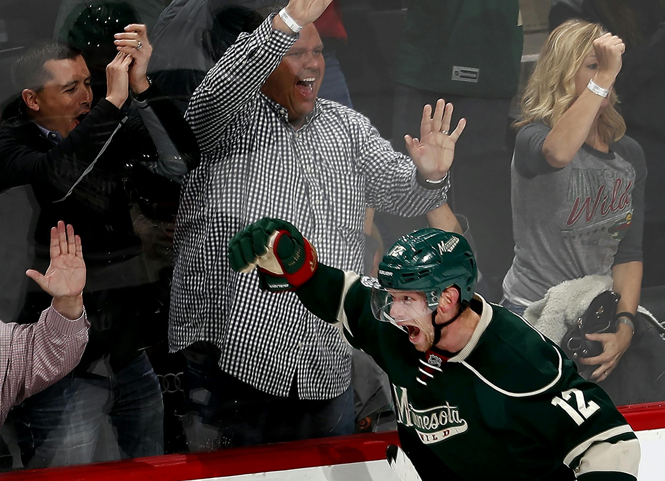 Eric Staal (12) celebrated after scoring the game tying goal late in the third period. Washington beat Minnesota 5-4 in overtime.