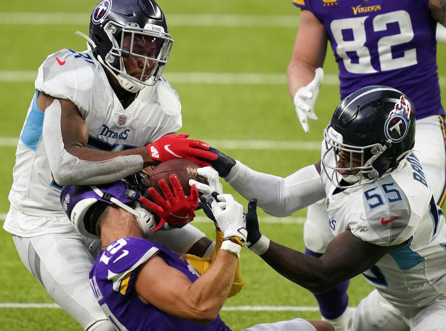 Tennessee inside linebacker Jayon Brown (55) and free safety Kevin Byard (31) batted away a pass meant for Vikings receiver Adam Thielen in the fourth quarter.