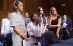 From left, U.S. gymnasts Aly Raisman, Simone Biles, McKayla Maroney and Maggie Nichols leave after testifying at a Senate Judiciary Committee hearing 