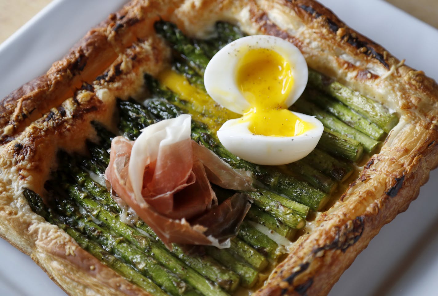 Asparagus Galette. Gruyere, Dijon, prosciutto, egg and lemon at the New Scenic Cafe up the shore north of Duluth. ] CARLOS GONZALEZ cgonzalez@startribune.com - June 4, 2016, Duluth, MN, Taste Section Story Food, Coffee, Drinks, Bars and Restaurants of the Duluth Area