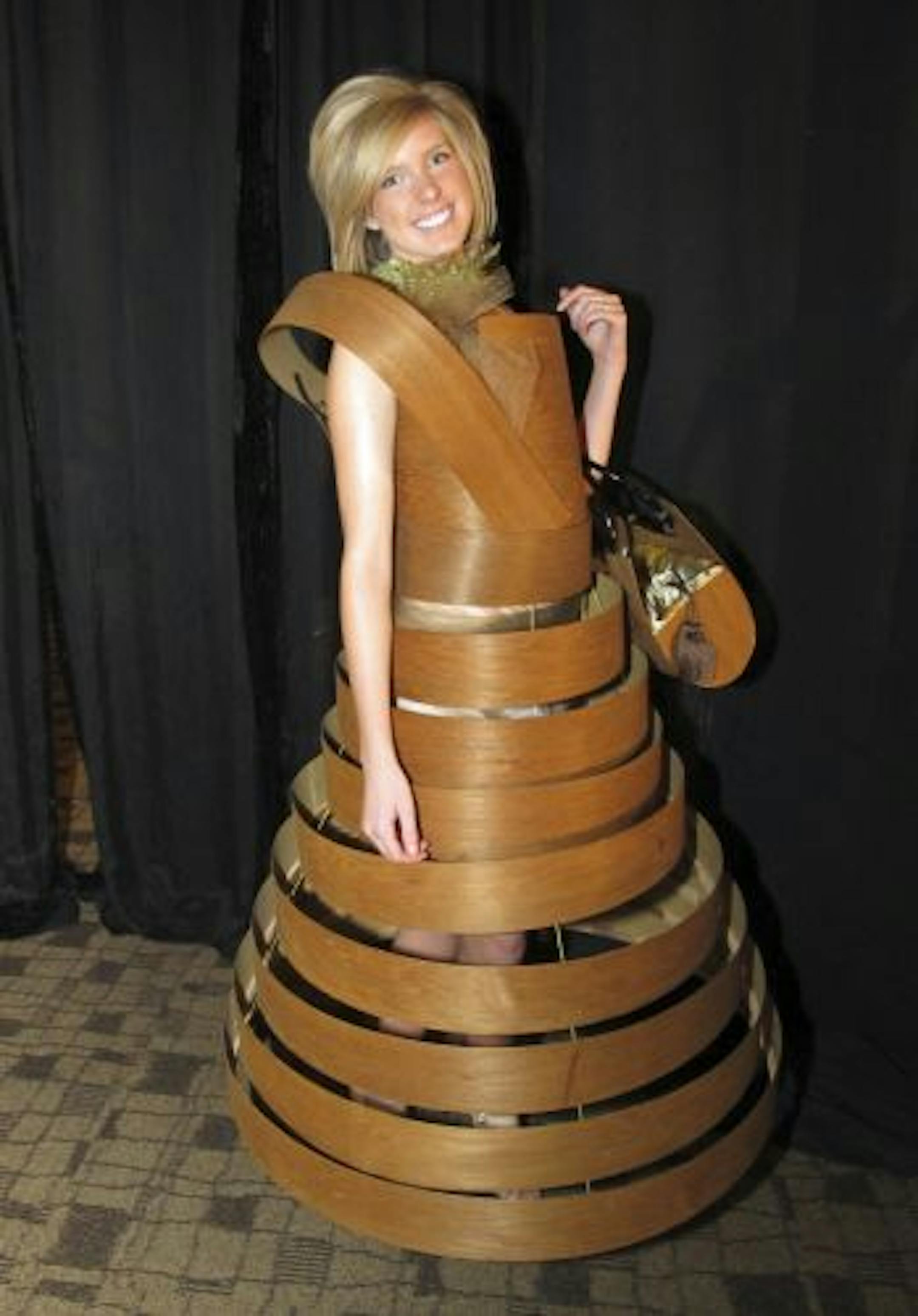 Cecely Spohn in a wood veneer dress by Howard Roark Associates