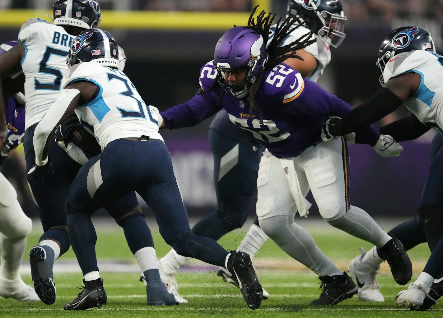 Minnesota Vikings defensive tackle Sheldon Day (52) gets an arm around Tennessee Titans running back Tyjae Spears (32) in the first quarter of an NFL preseason game between the Minnesota Vikings and the Tennessee Titans Saturday, Aug. 19, 2023 at U.S. Bank Stadium in Minneapolis. ] ANTHONY SOUFFLE • anthony.souffle@startribune.com