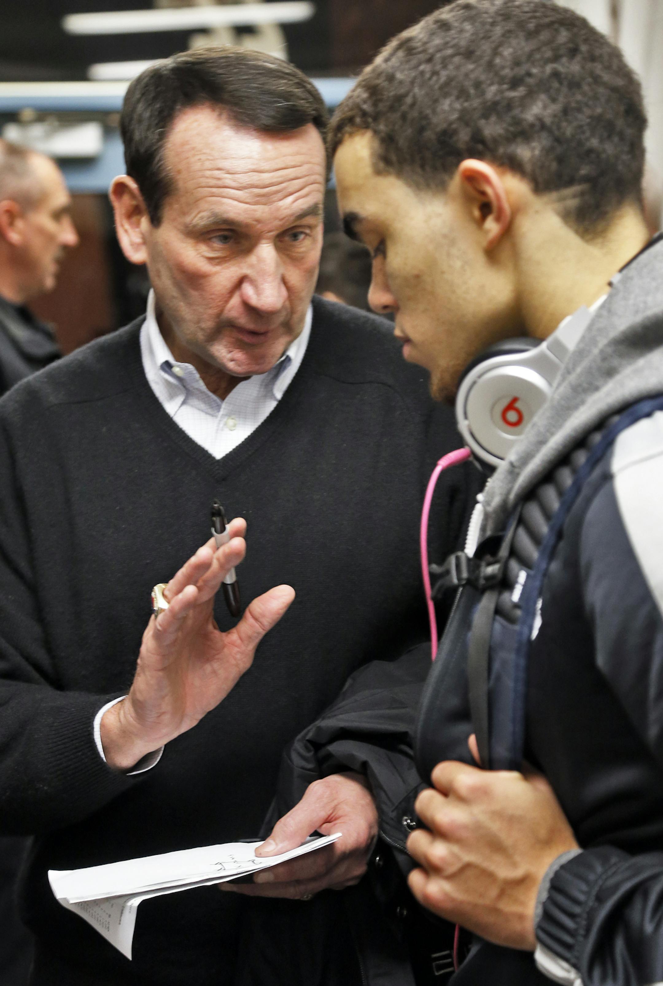 Prep basketball - Apple Valley vs. Whitney Young of Chicago. Top prep players Tyus Jones and Jahlil Okafor compete. Whitney Young won the game 80-70. duke head basketball coach Mike Krzyzewski, left, talked with Apple Valley's Tyus Jones at the end of the game. (MARLIN LEVISON/STARTRIBUNE(mlevison@startribune.com)